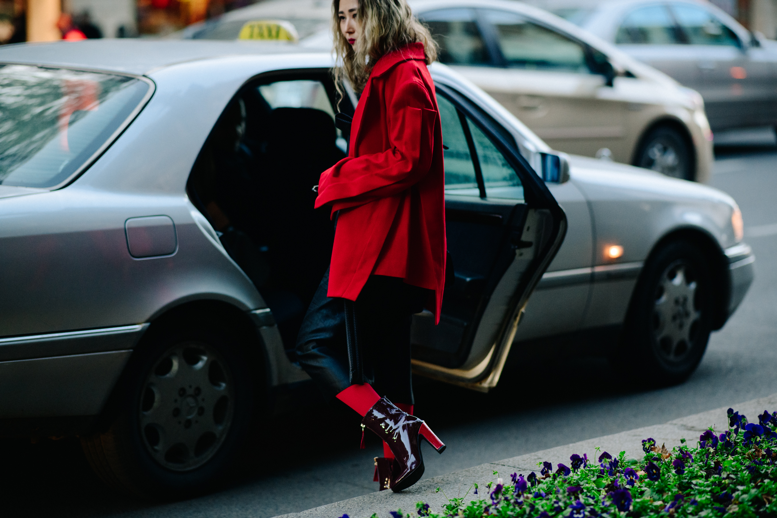 Woman wearing red socks and coat