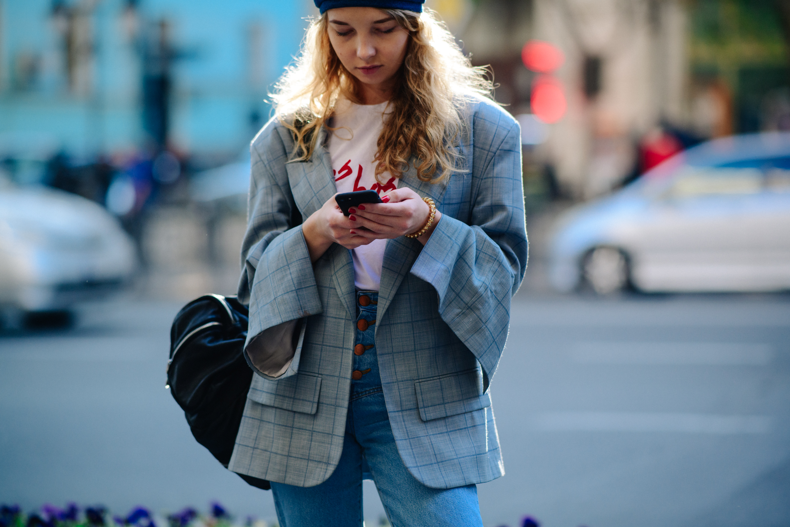 Girl wearing grey check suit jacket