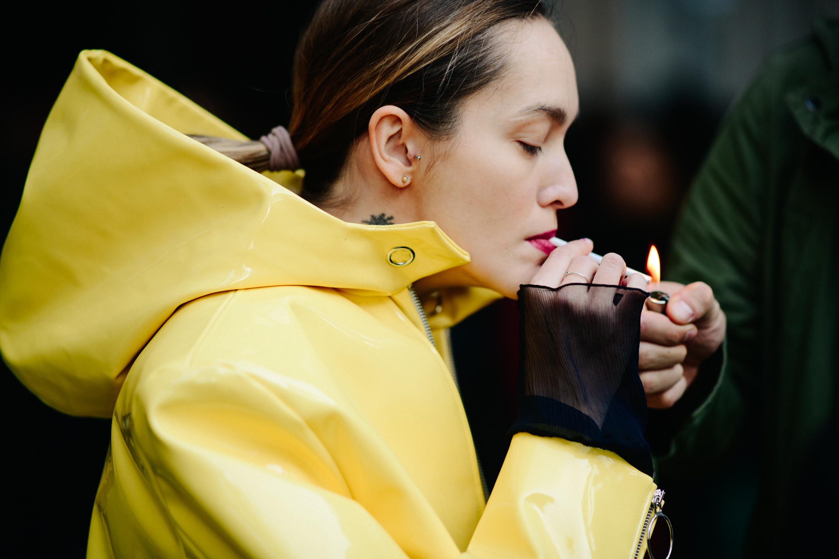 Woman wearing yellow hooded coat