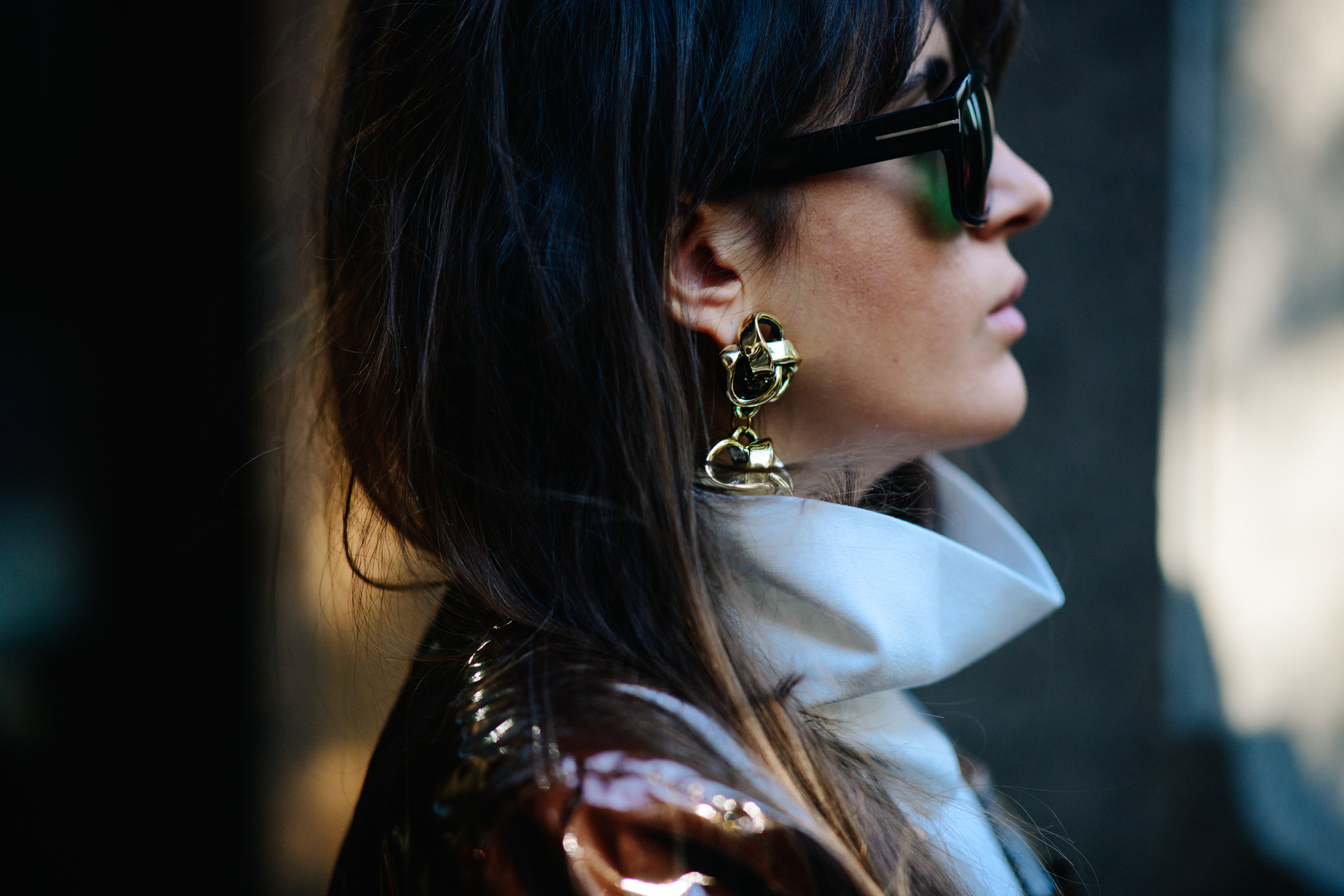 Woman wearing gold earrings