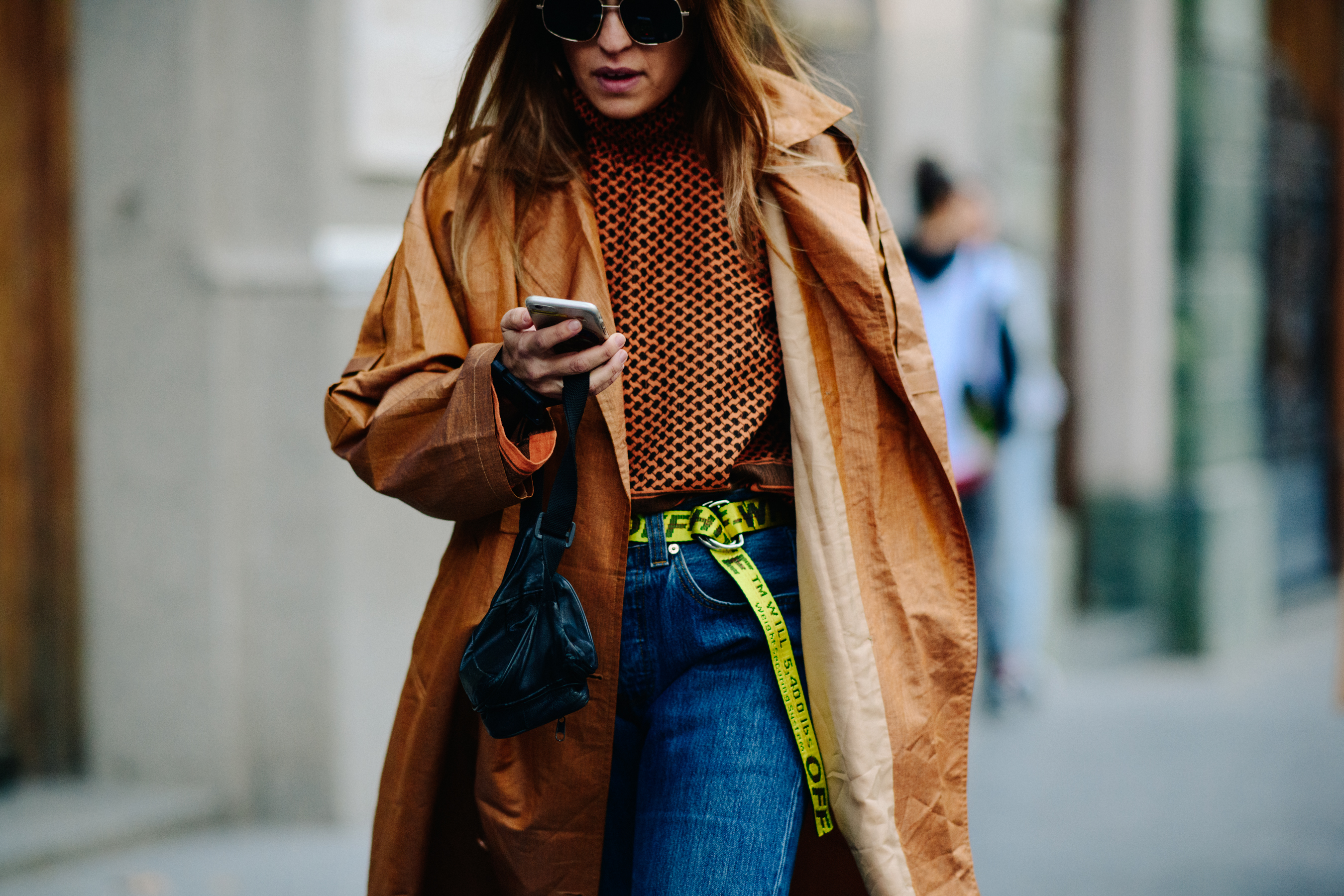 Girl wearing brown coat and top