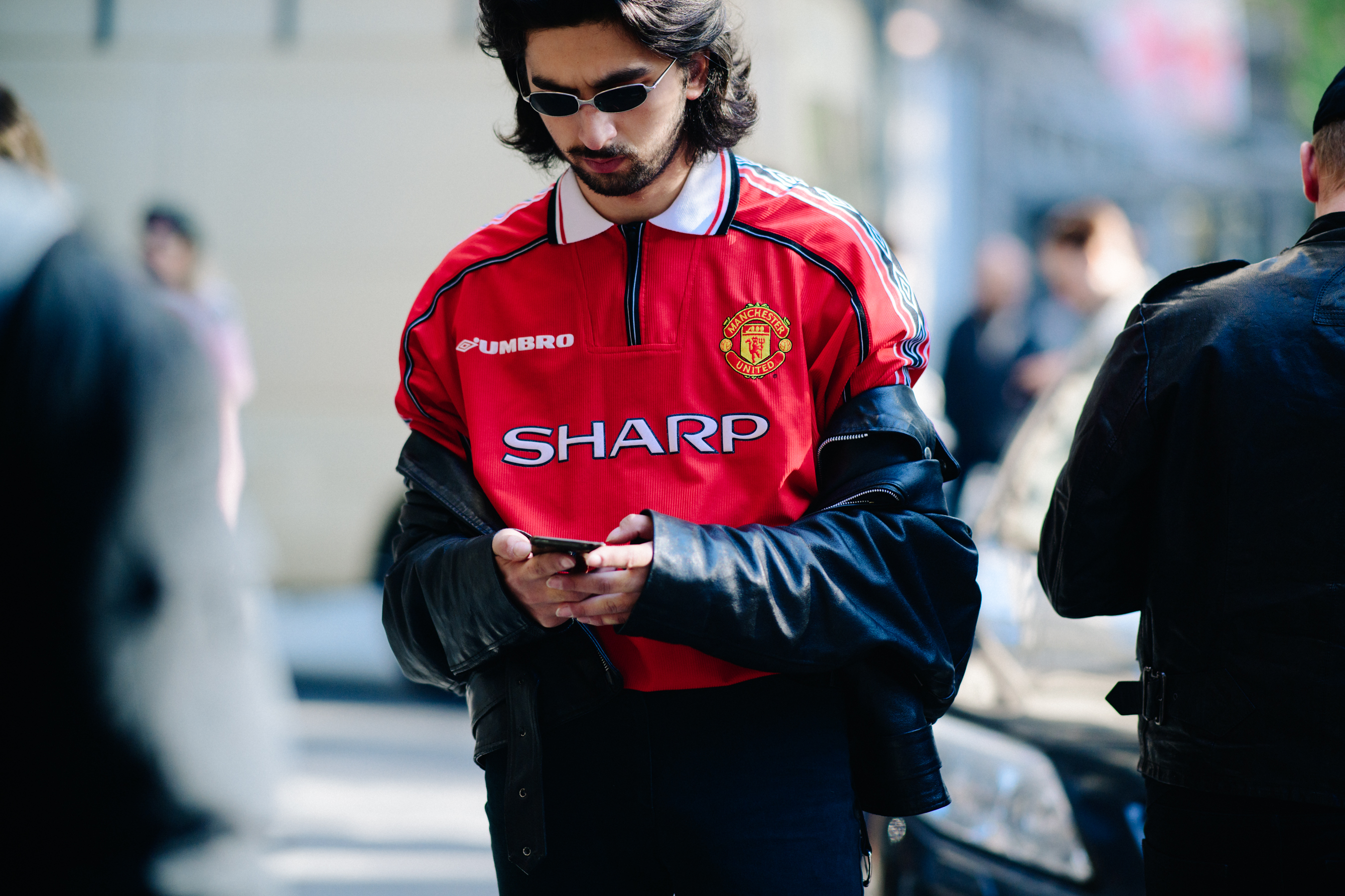 Man wearing red football shirt