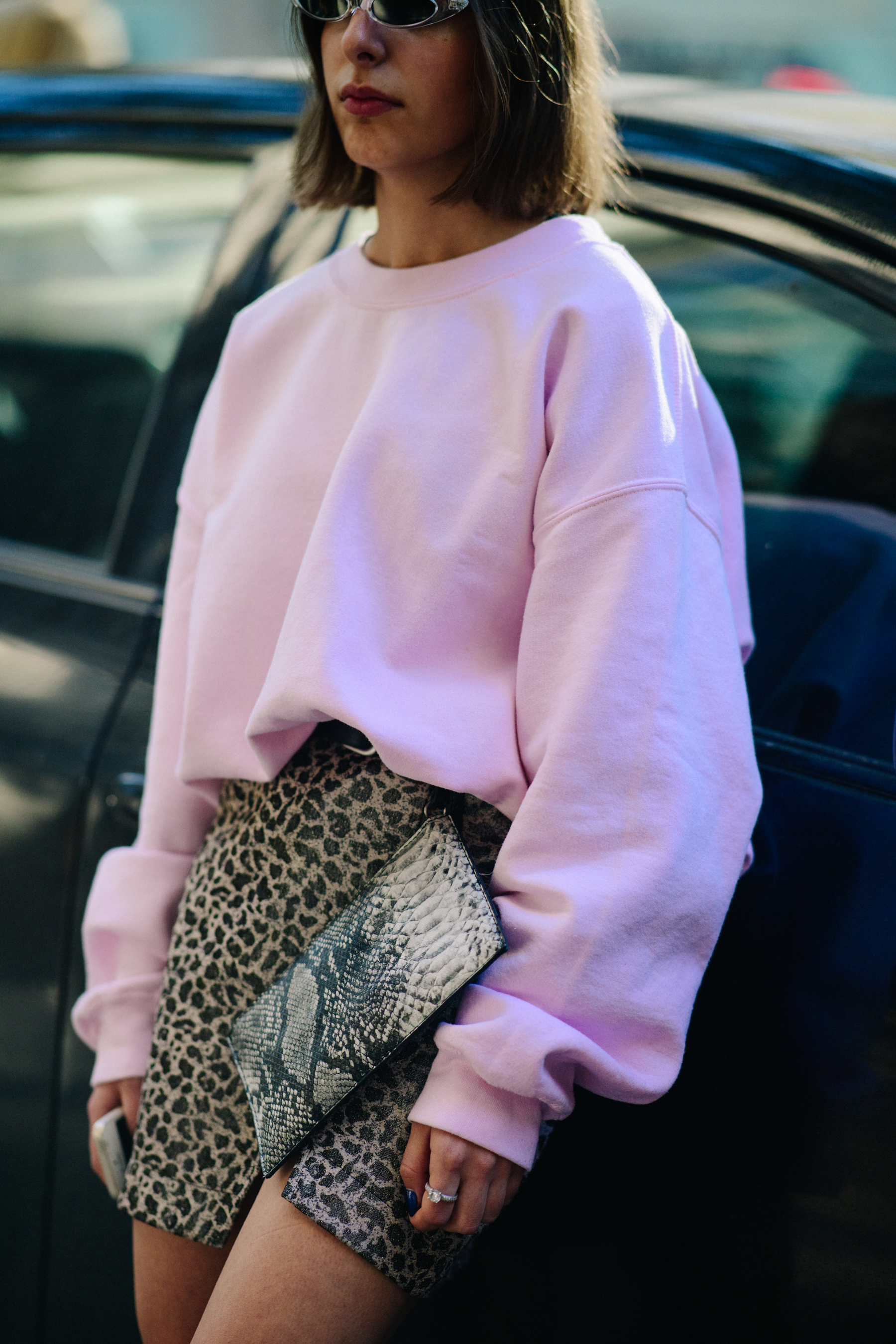 Girl wearing pink jumper and skirt