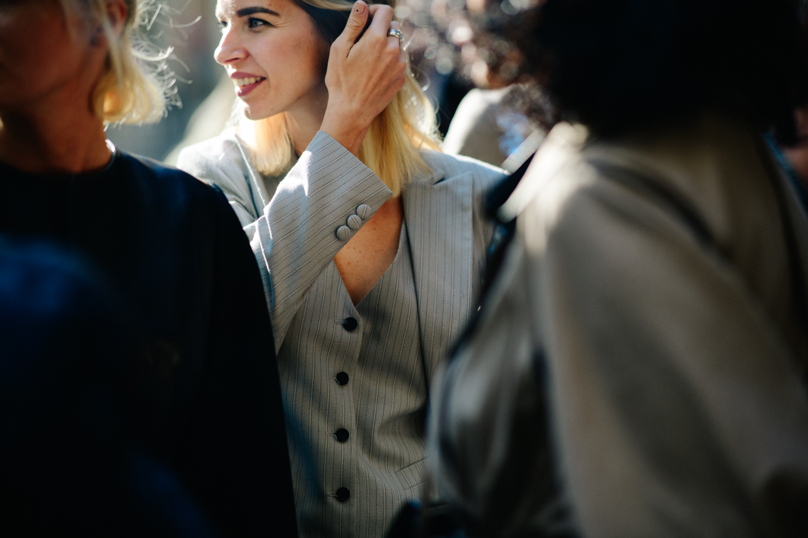 Woman wearing grey striped suit