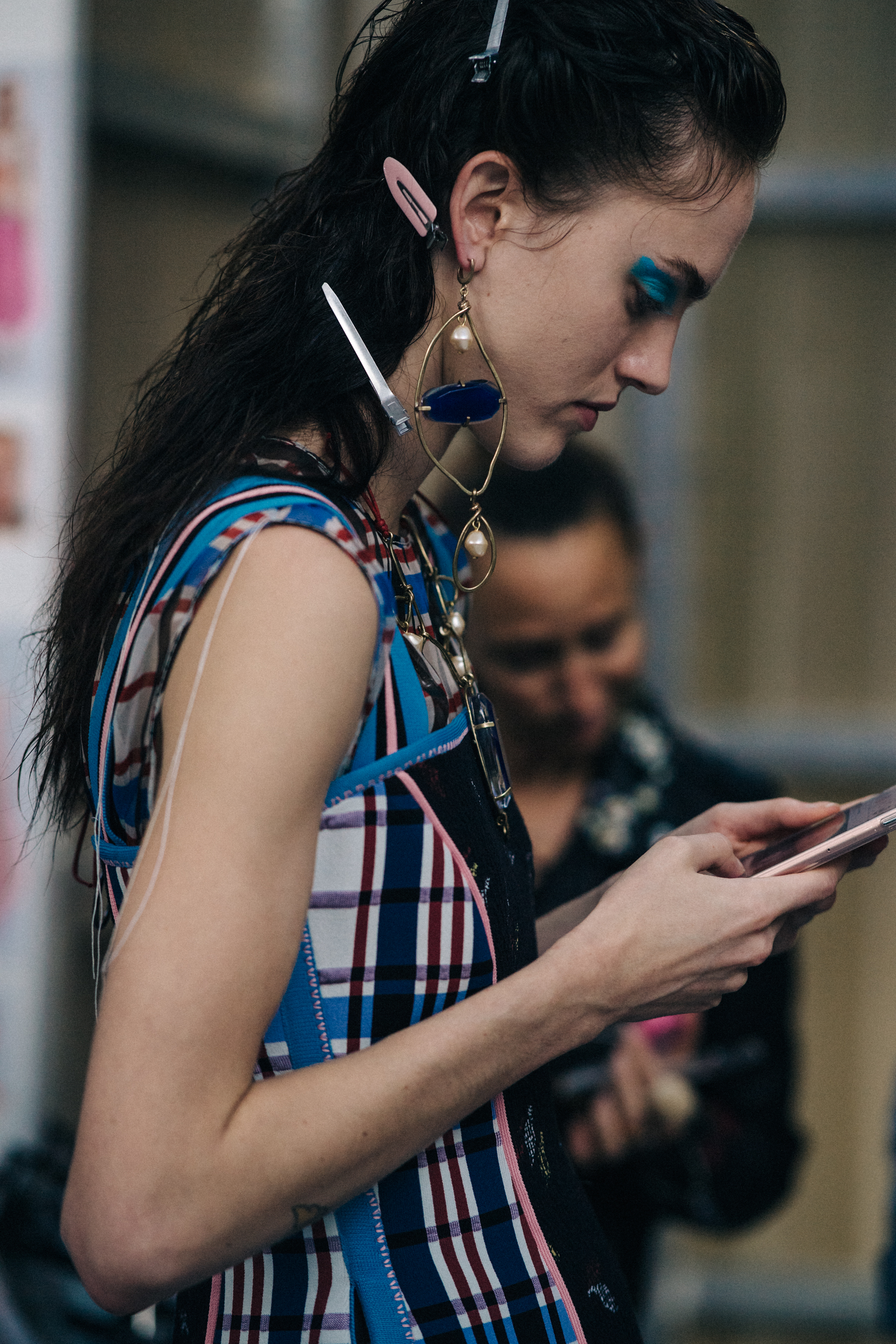 Model backstage in blue and pink