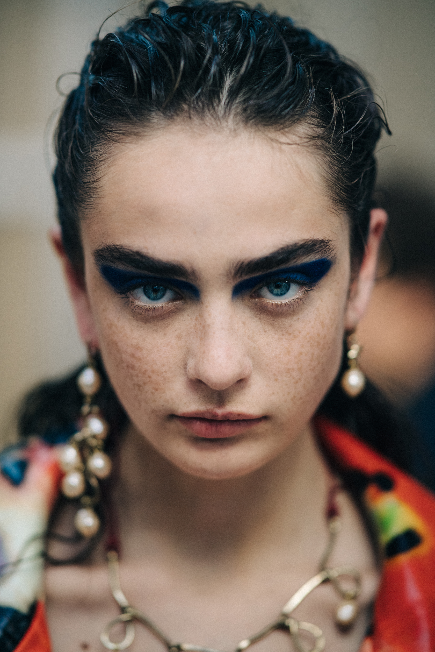 Portrait of model backstage in floral coat
