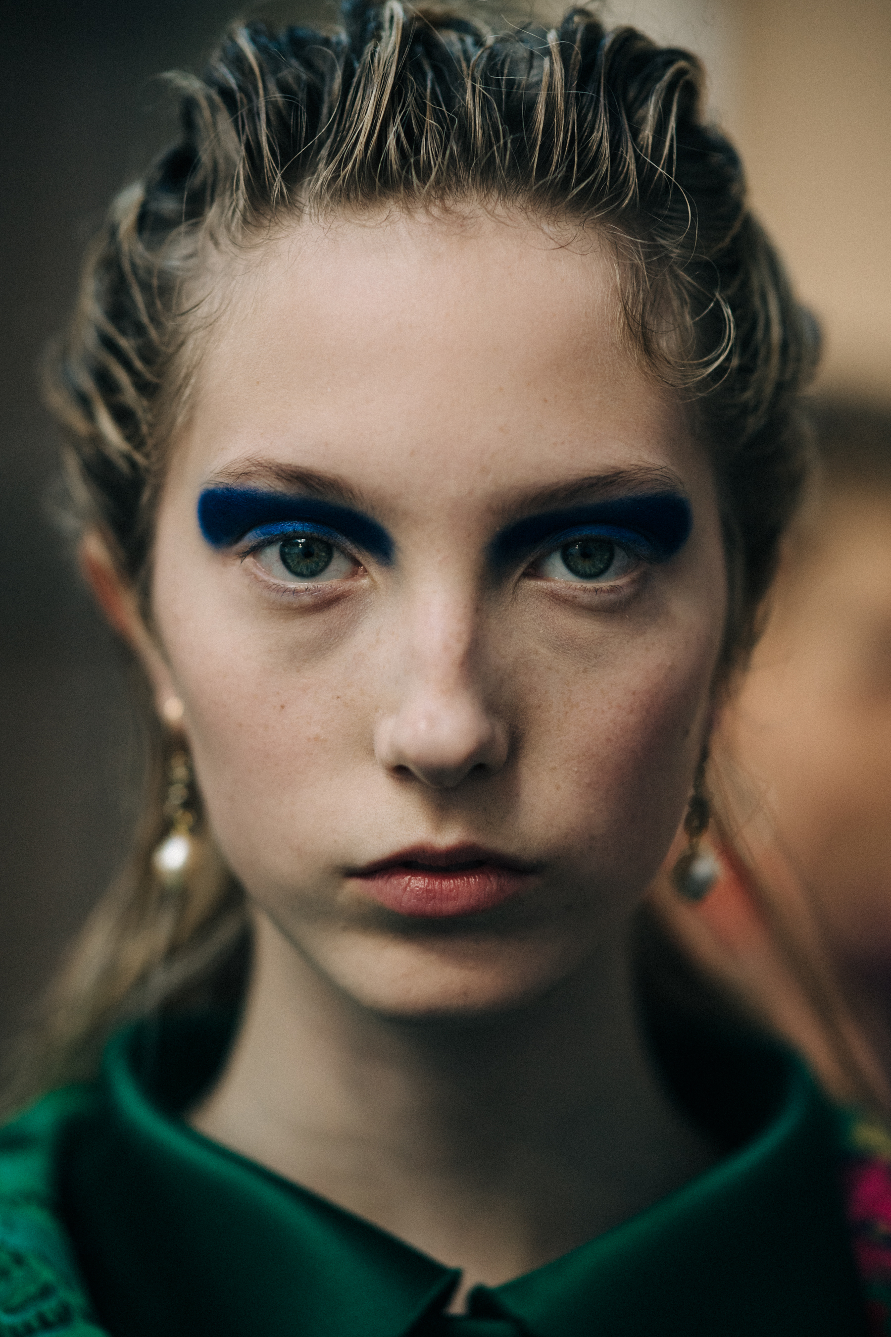 Portrait of model with green eyes and blonde hair