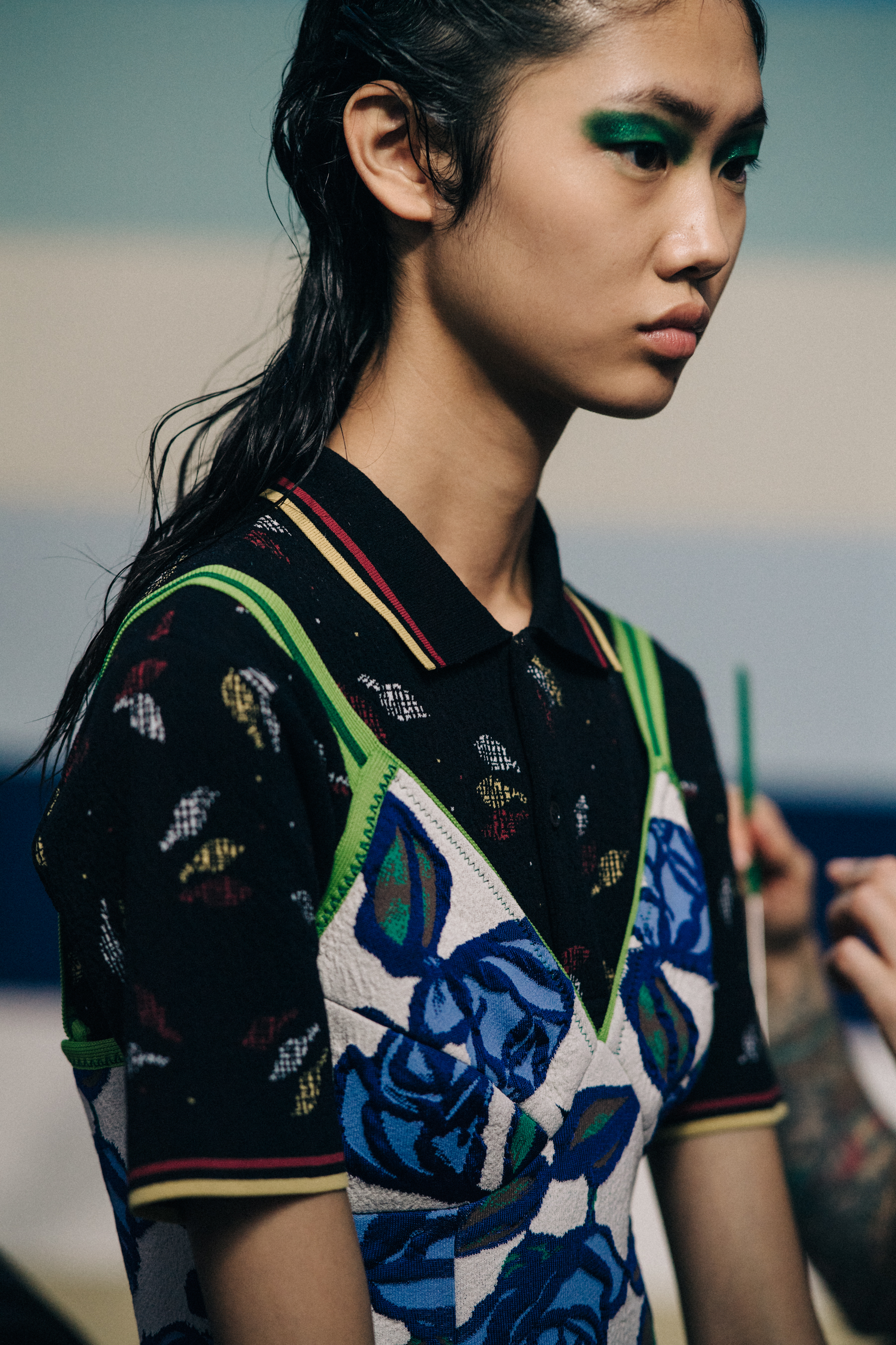 Model backstage with green eyes