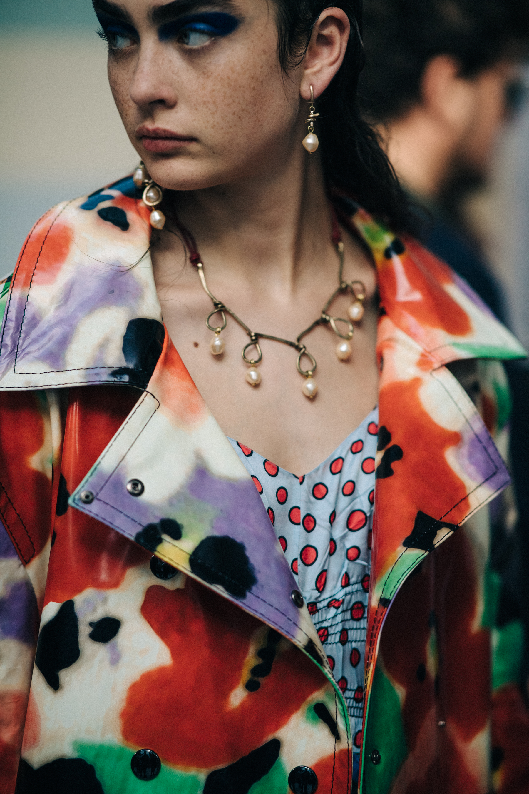 Closeup of coloured coat on model