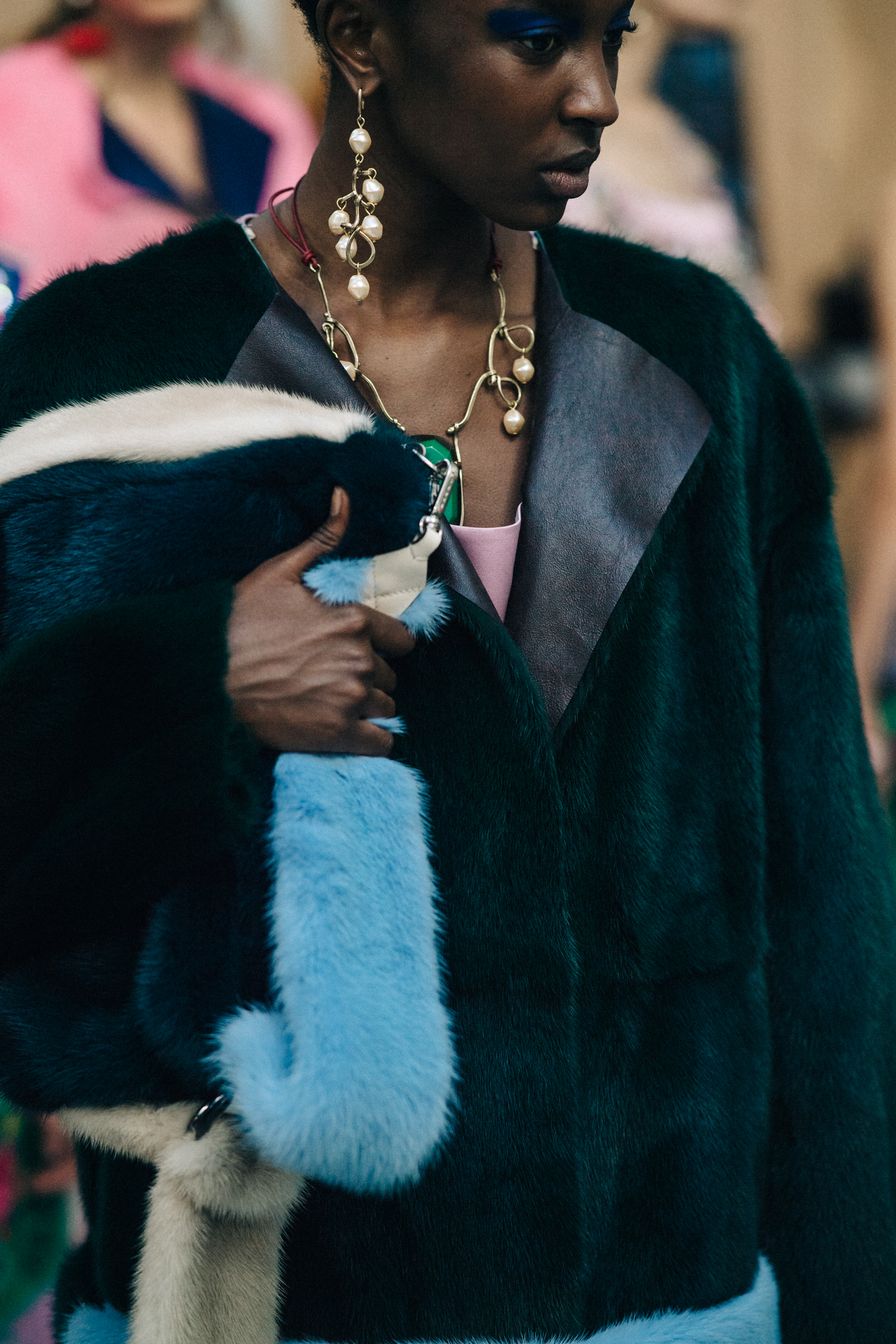 Model backstage wearing fur outfit