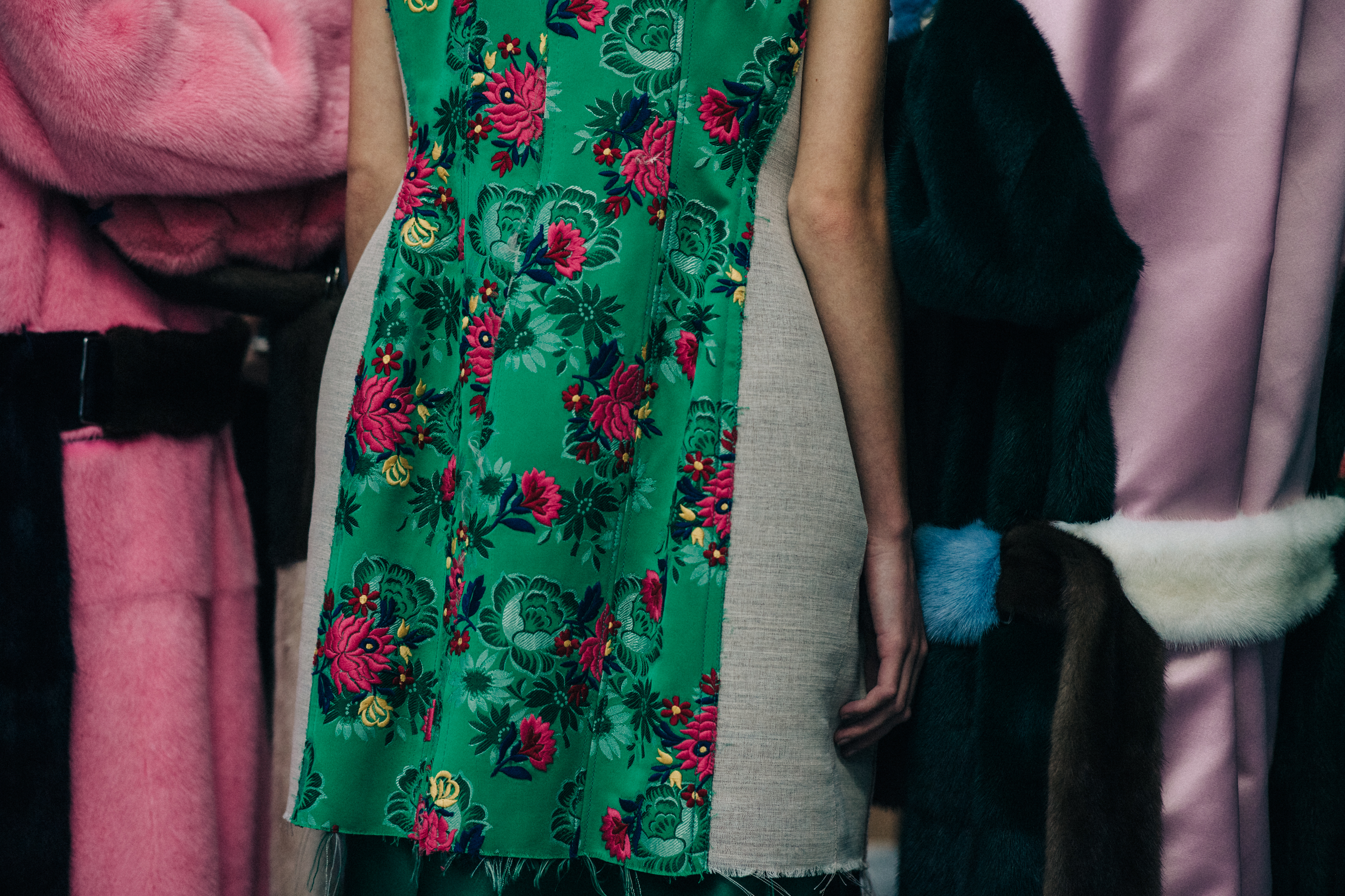 Closeup of models backstage in fur outfits