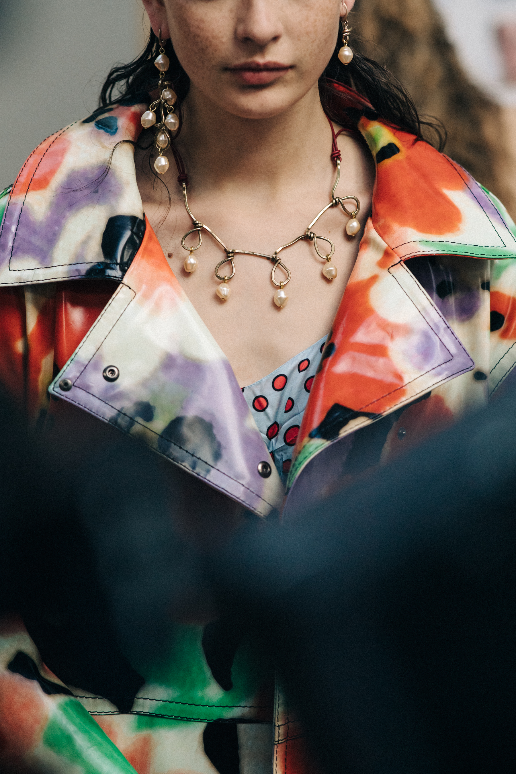 Closeup of model in floral coat