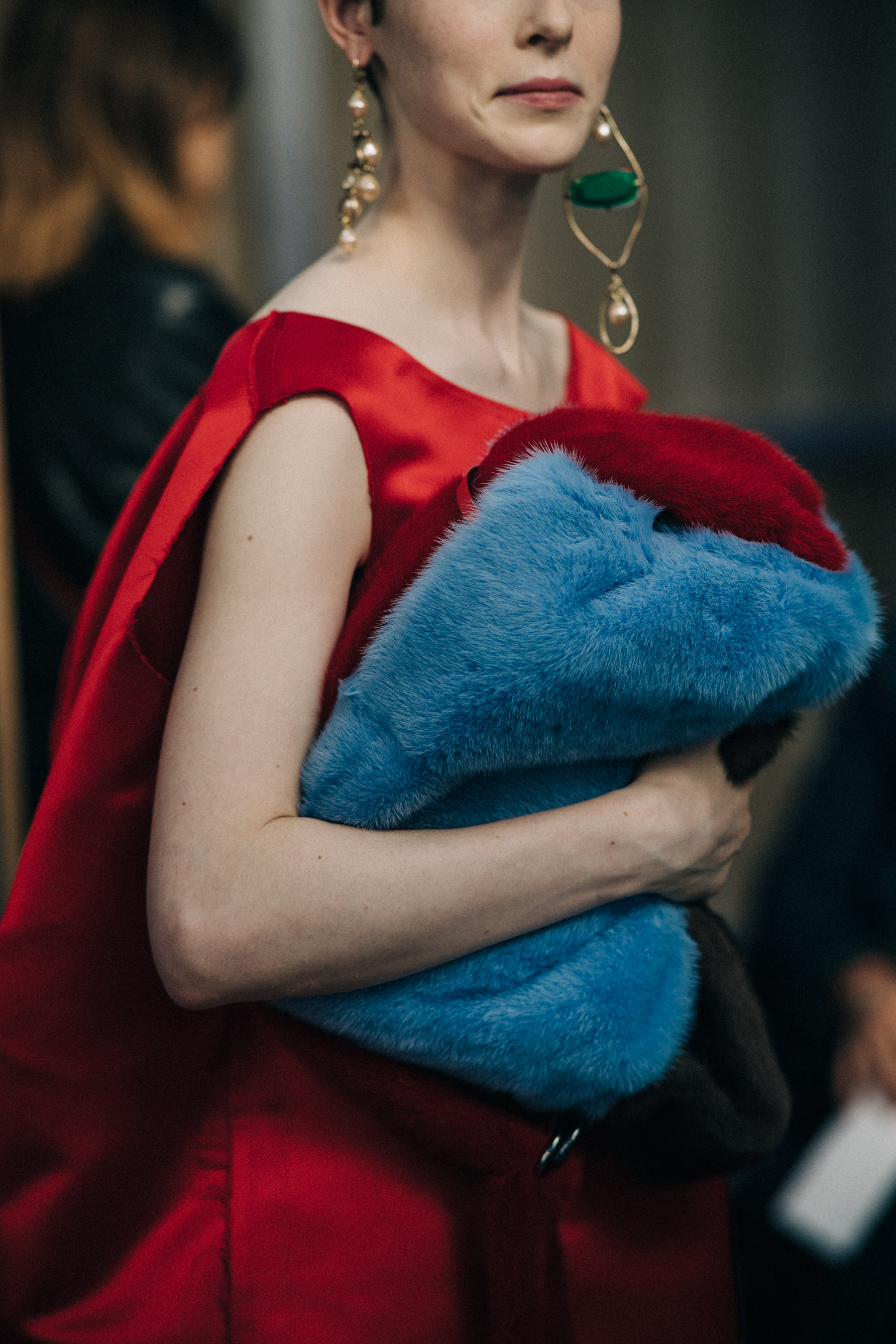 Crop of model in red top