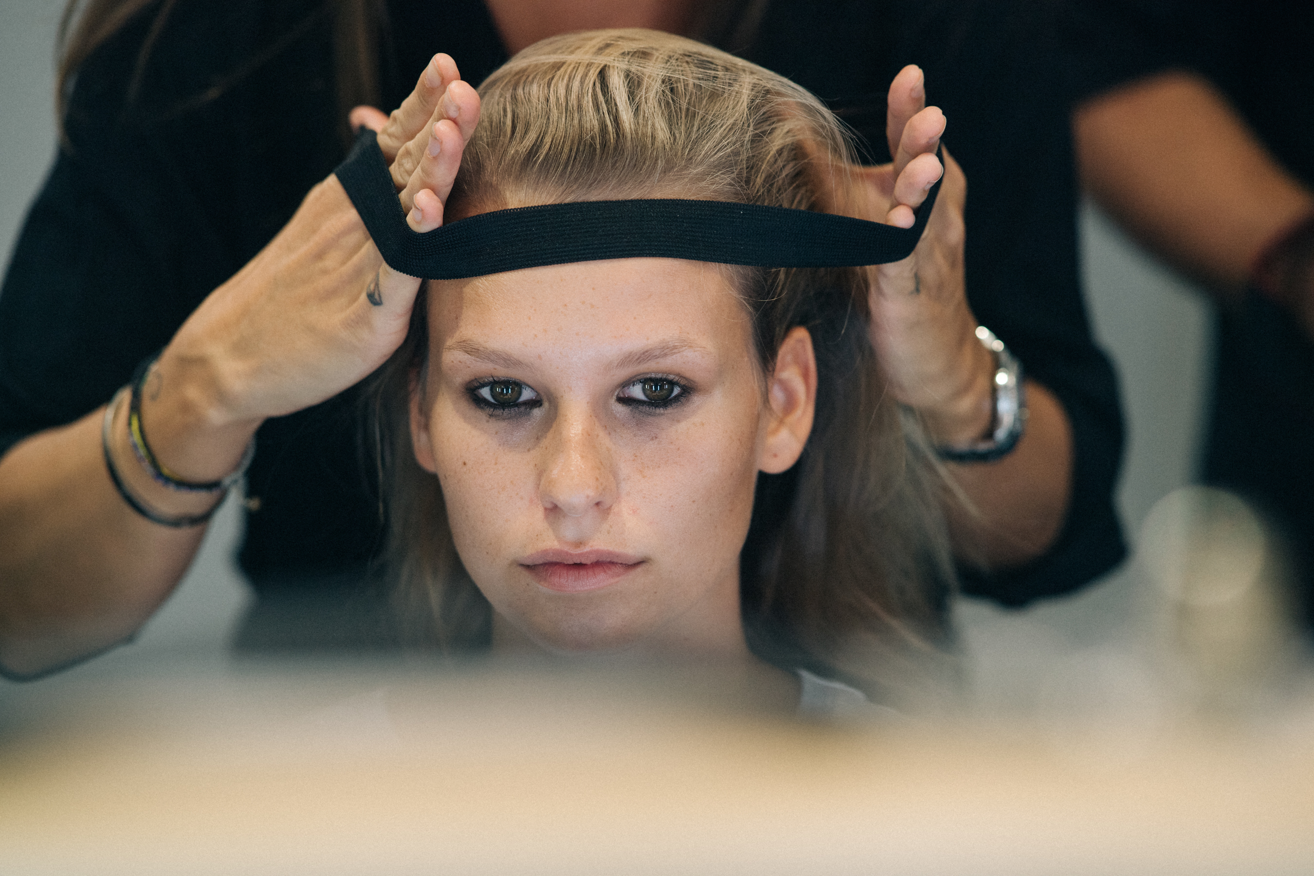Model getting hair and make up done