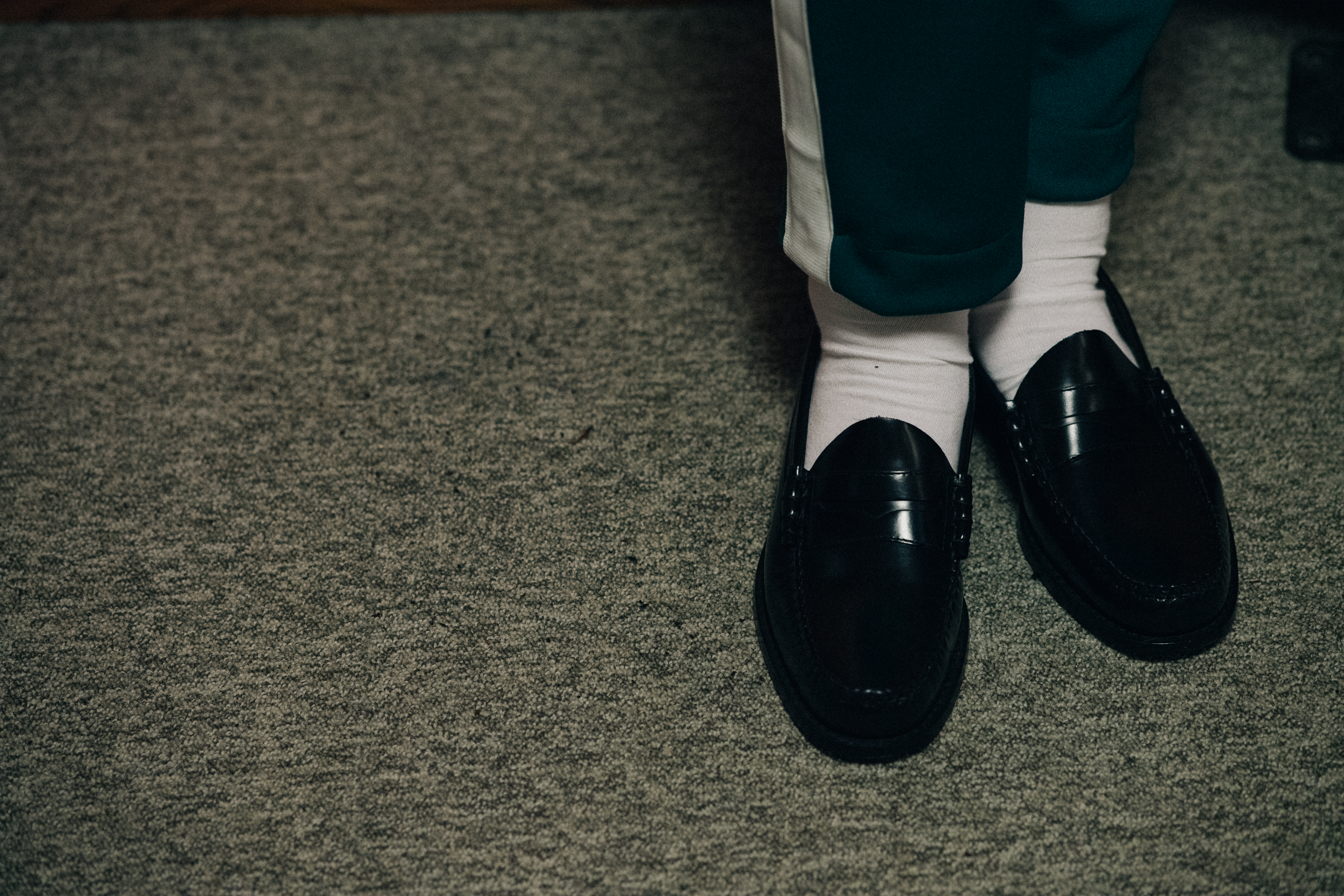 Model wearing mocasins and socks