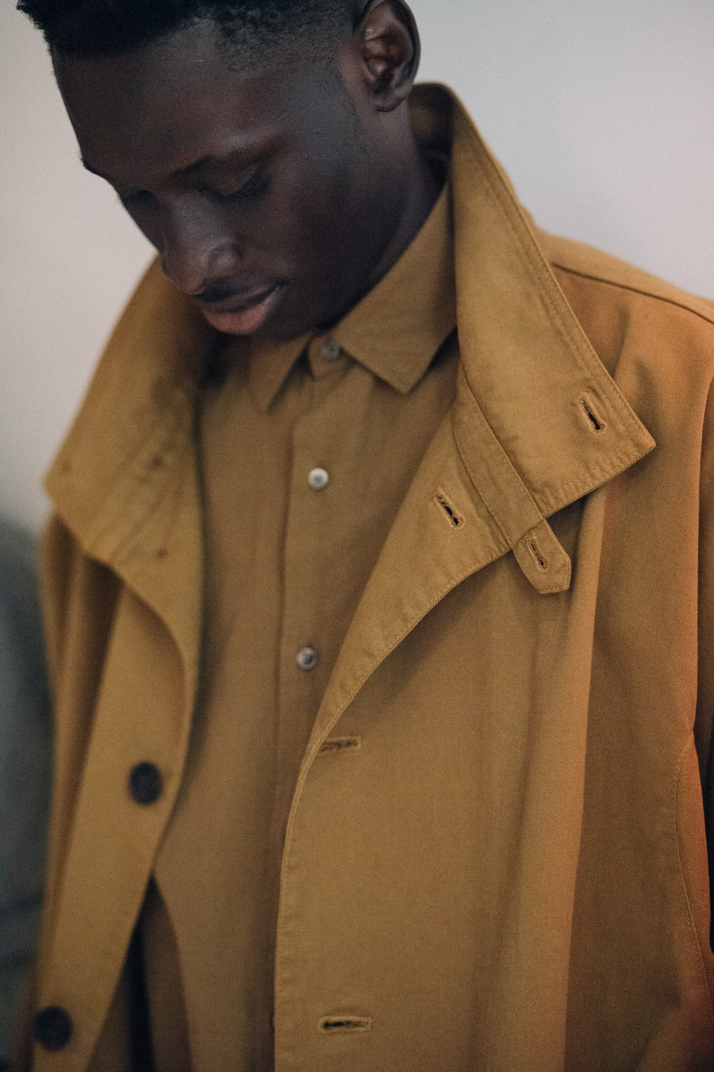 Male model wearing yellow outfit