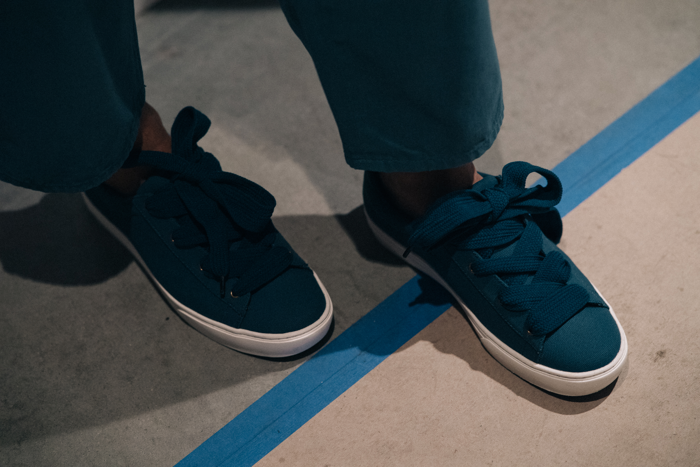 Sneakers with bow tied shoelaces