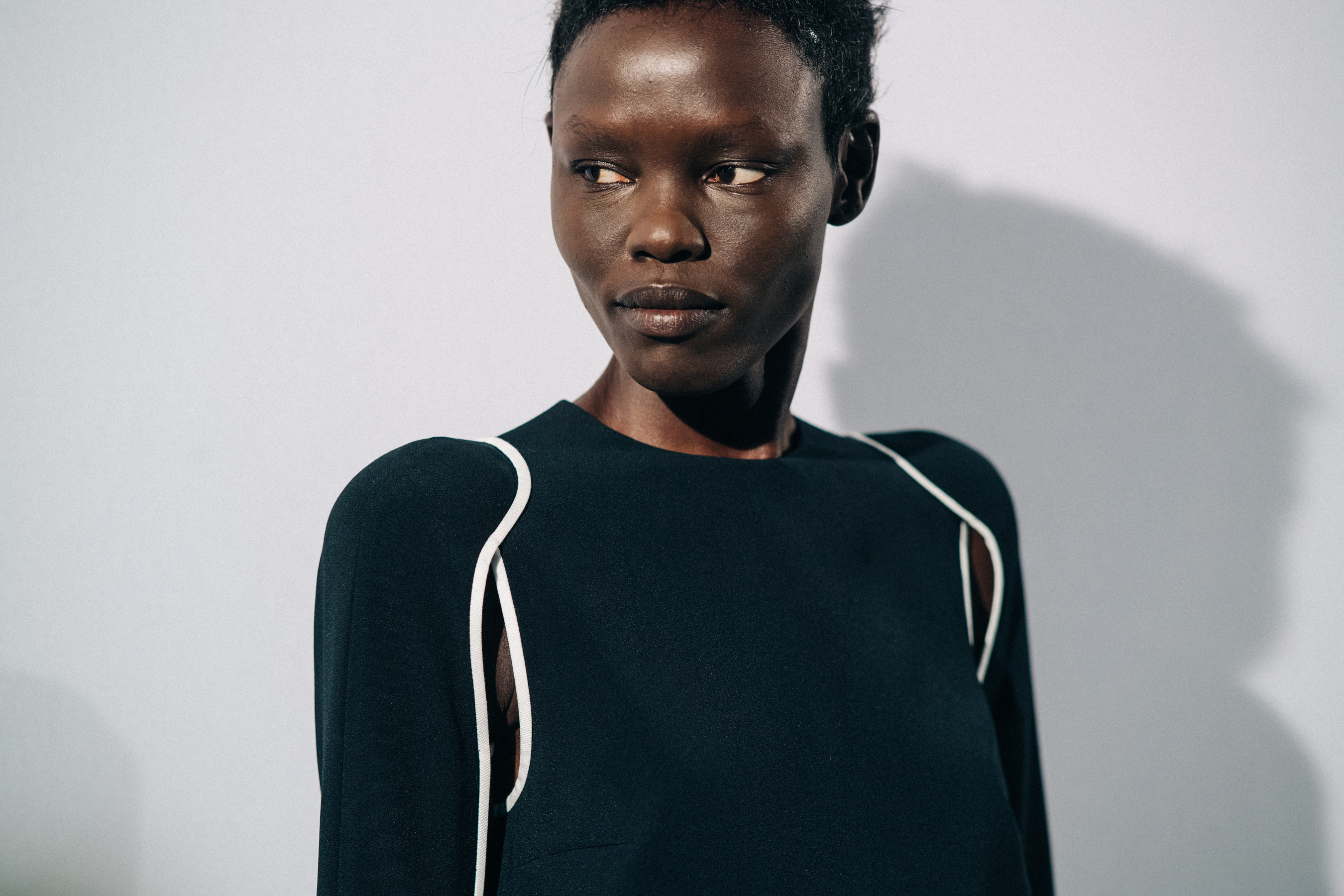 Model wearing black before a show