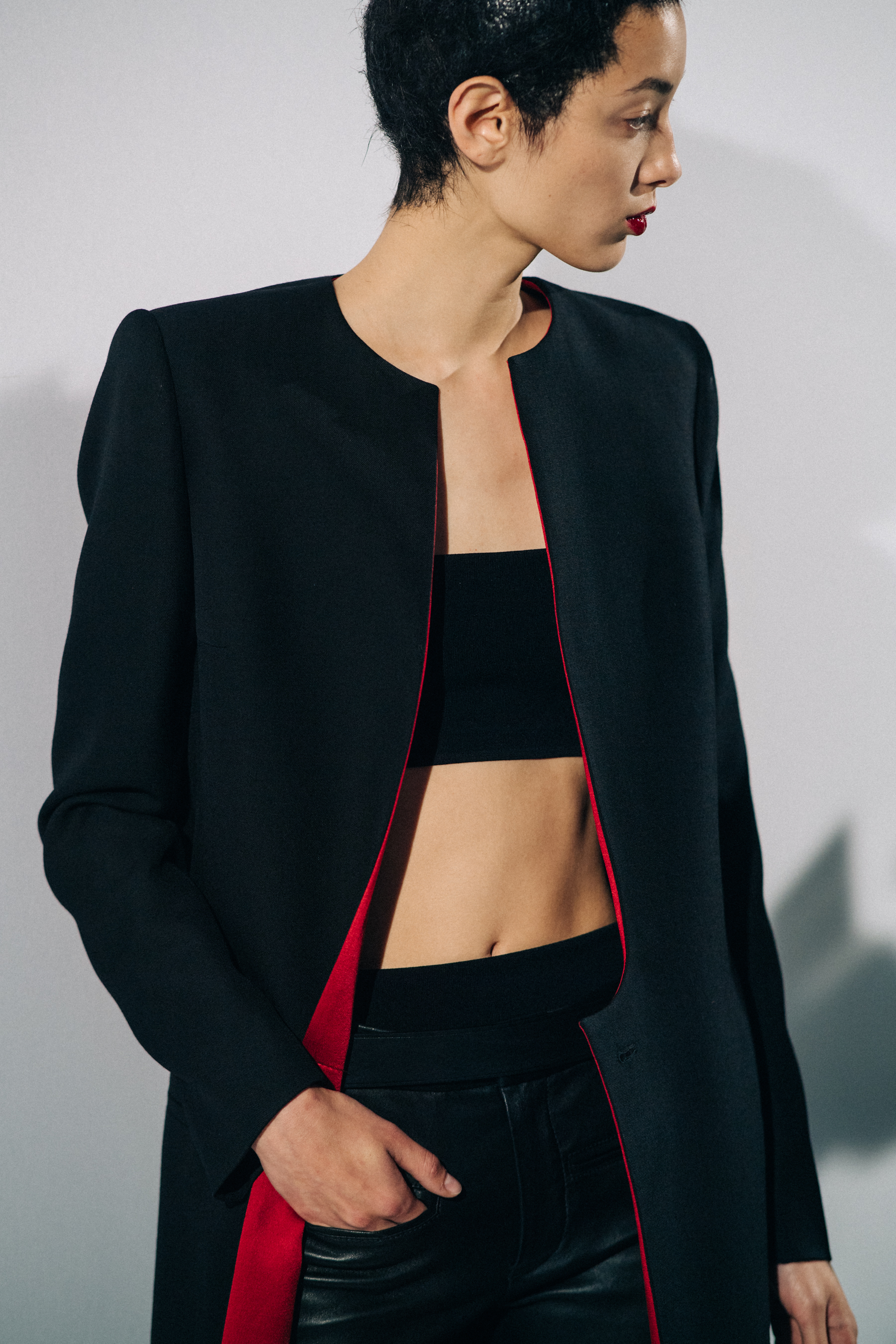 Model wearing black before a show
