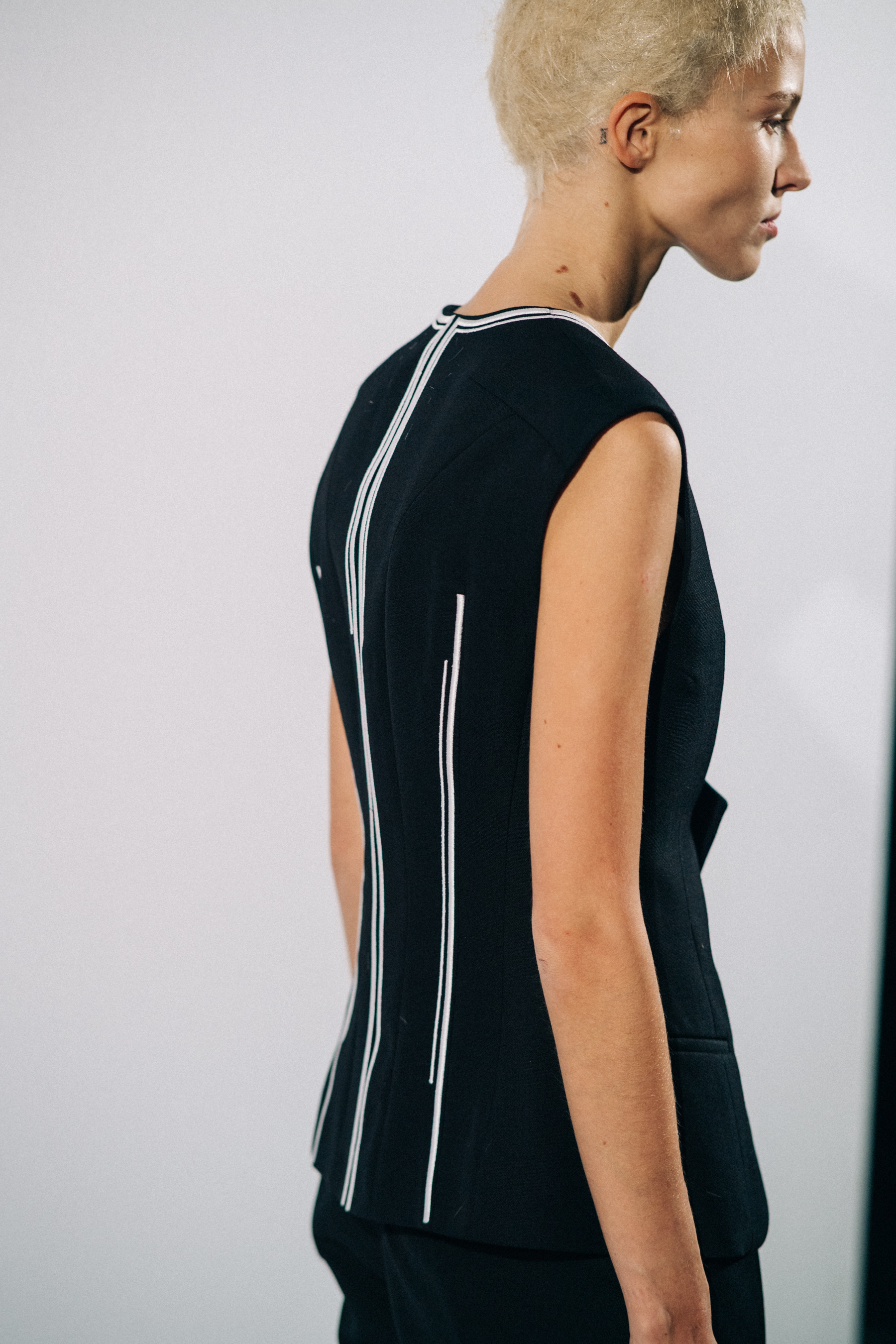 Model wearing black before a show