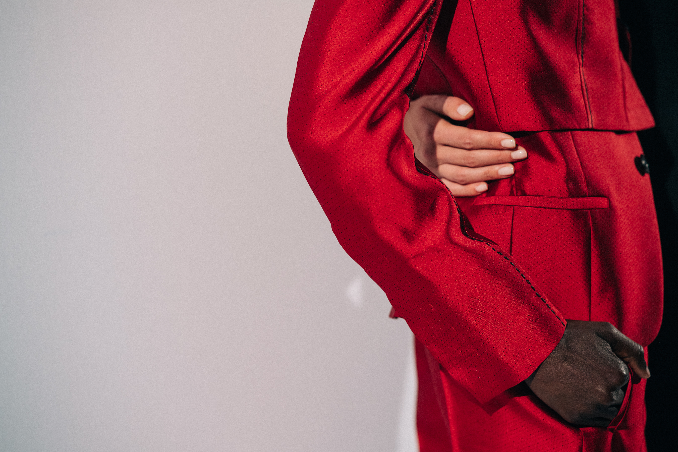 Model wearing red before a show