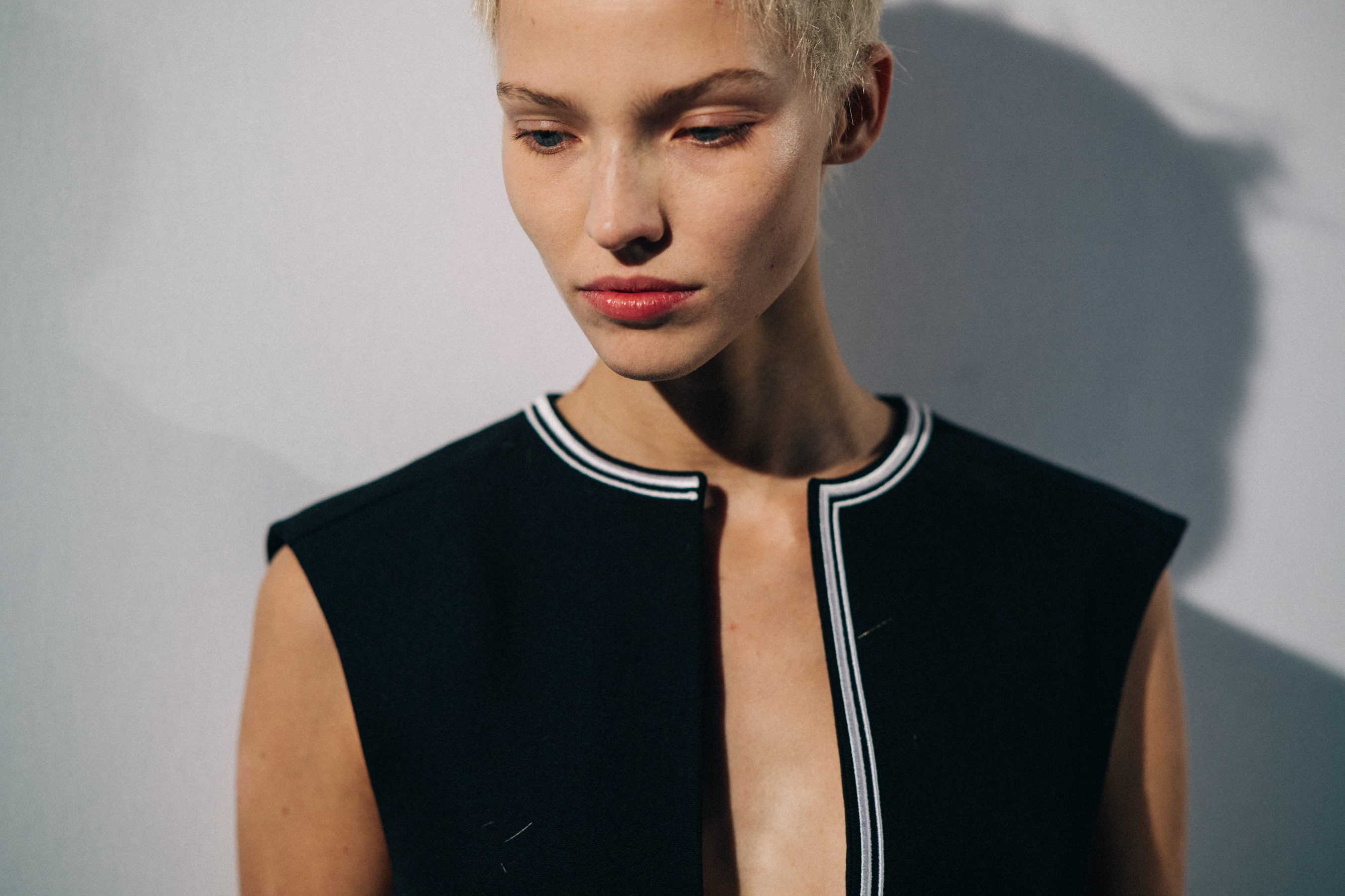 Model wearing black before a show