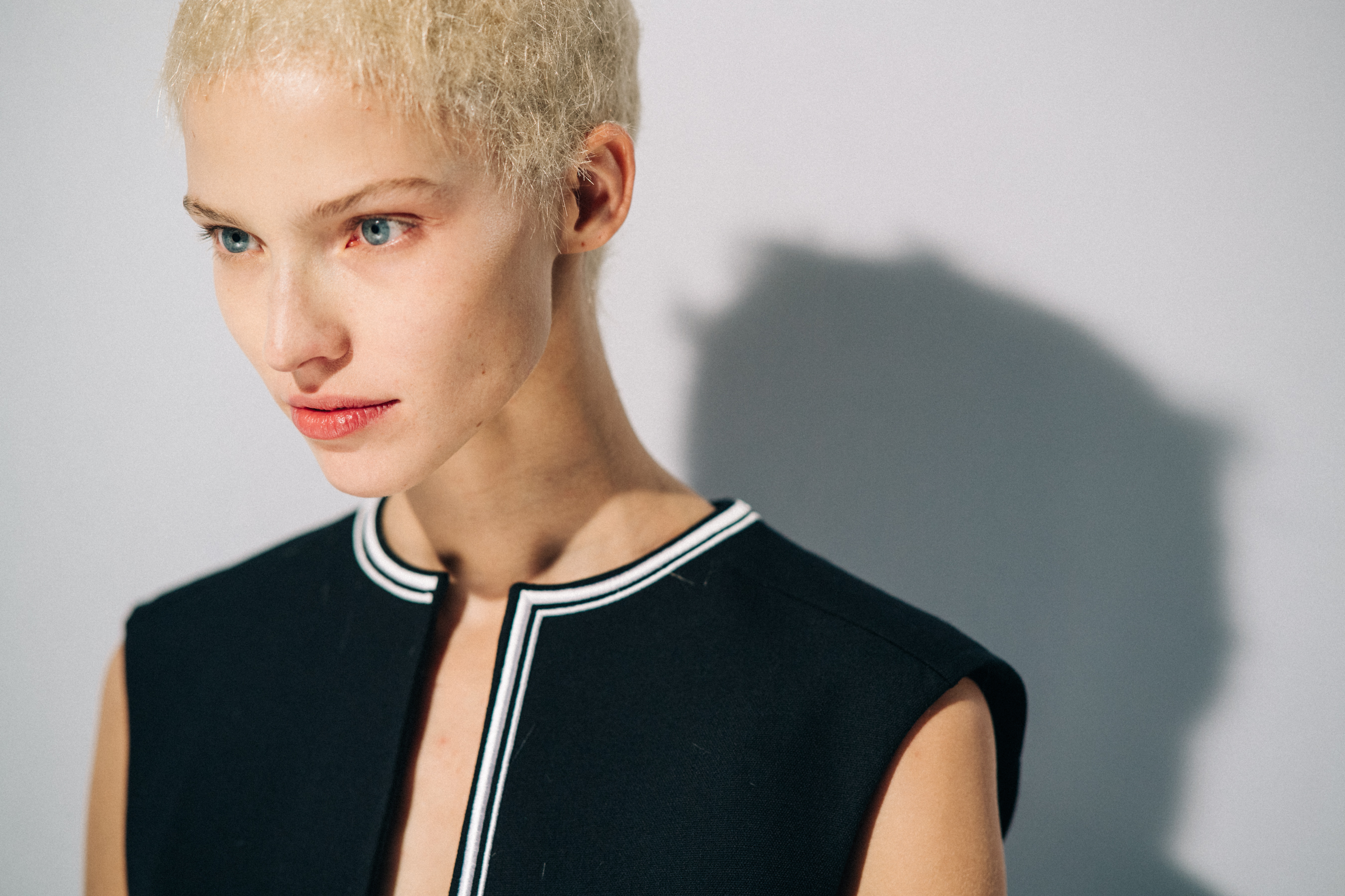 Model wearing black before a show