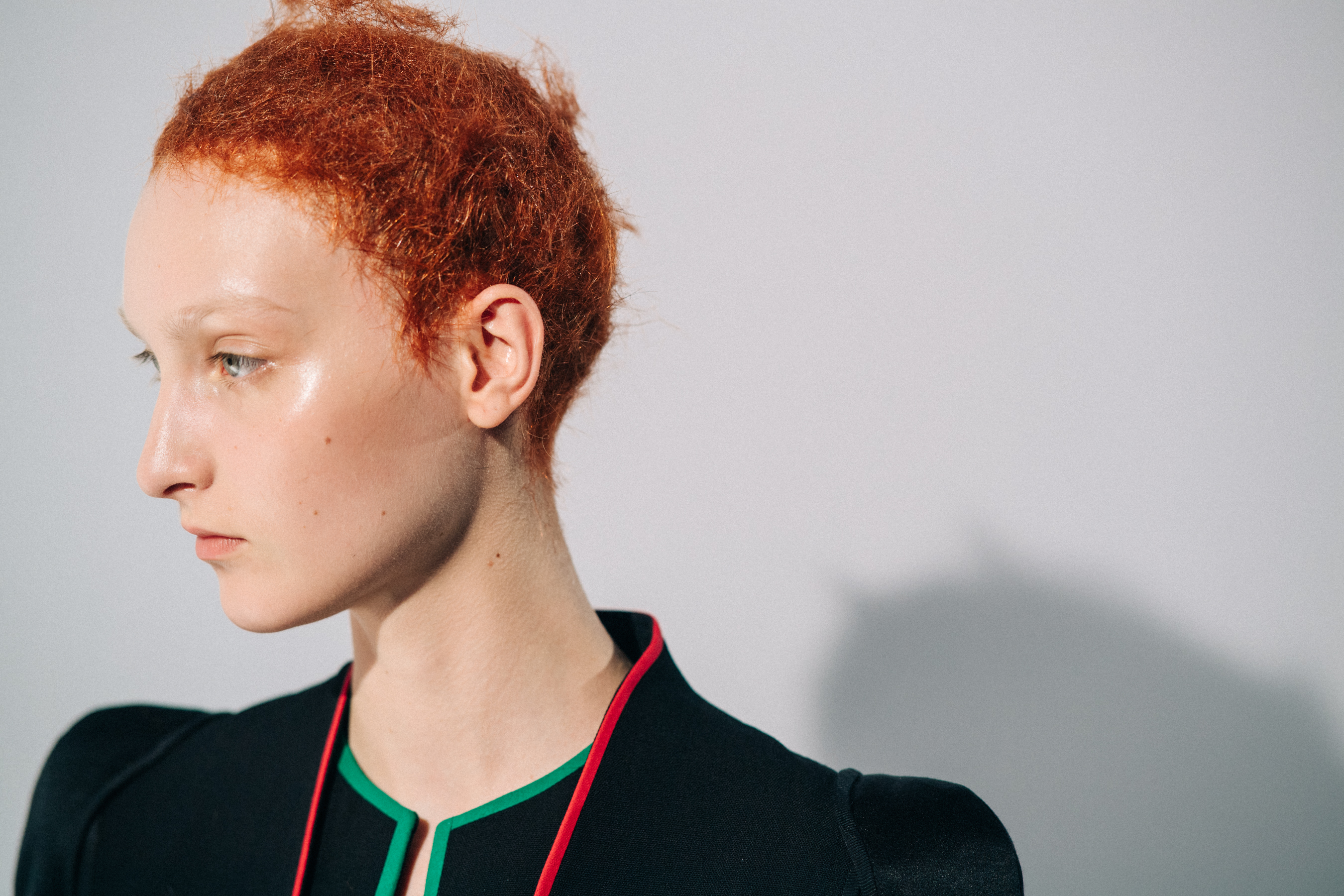 Model wearing black before a show