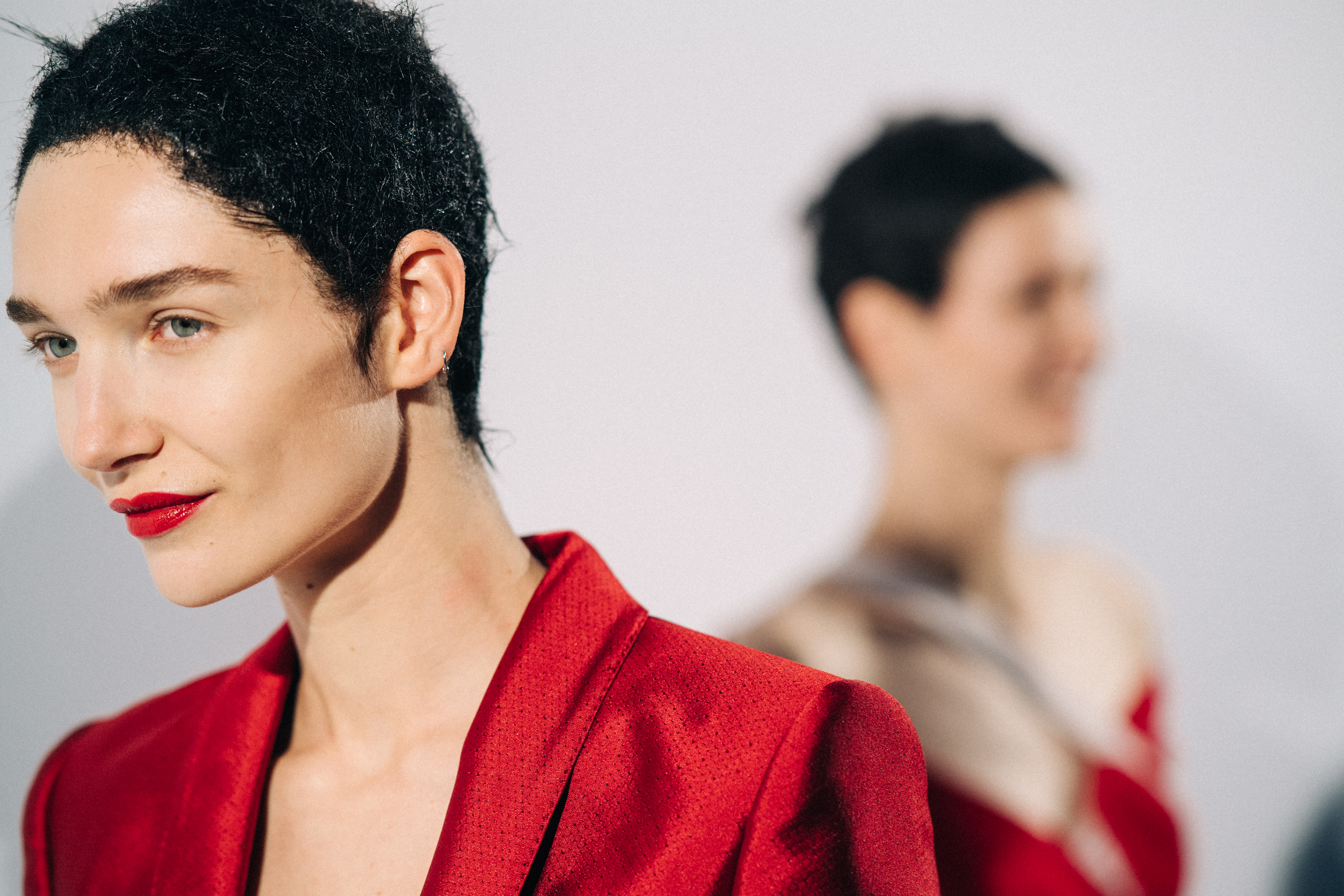 Model wearing red before a show