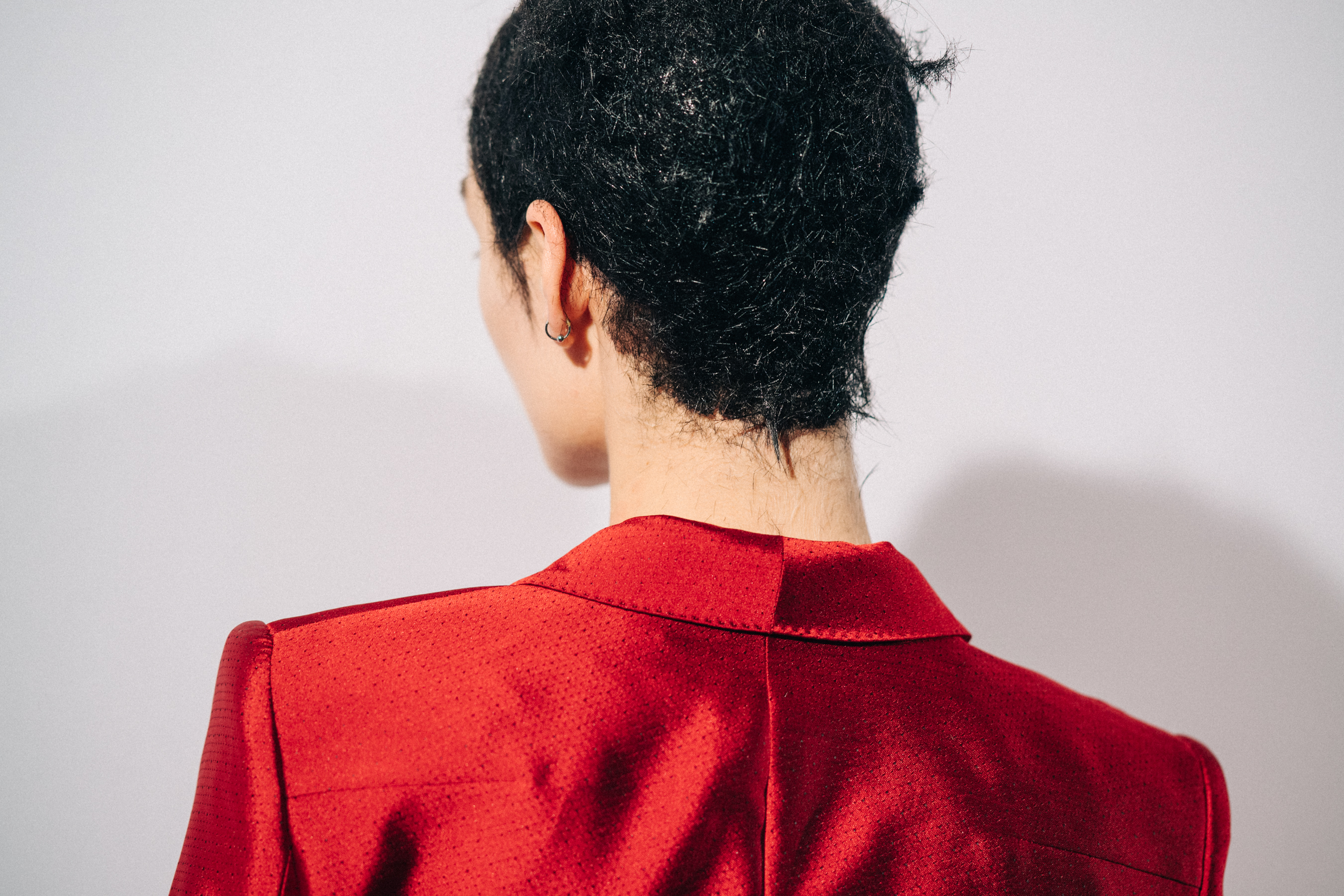Model wearing red before a show
