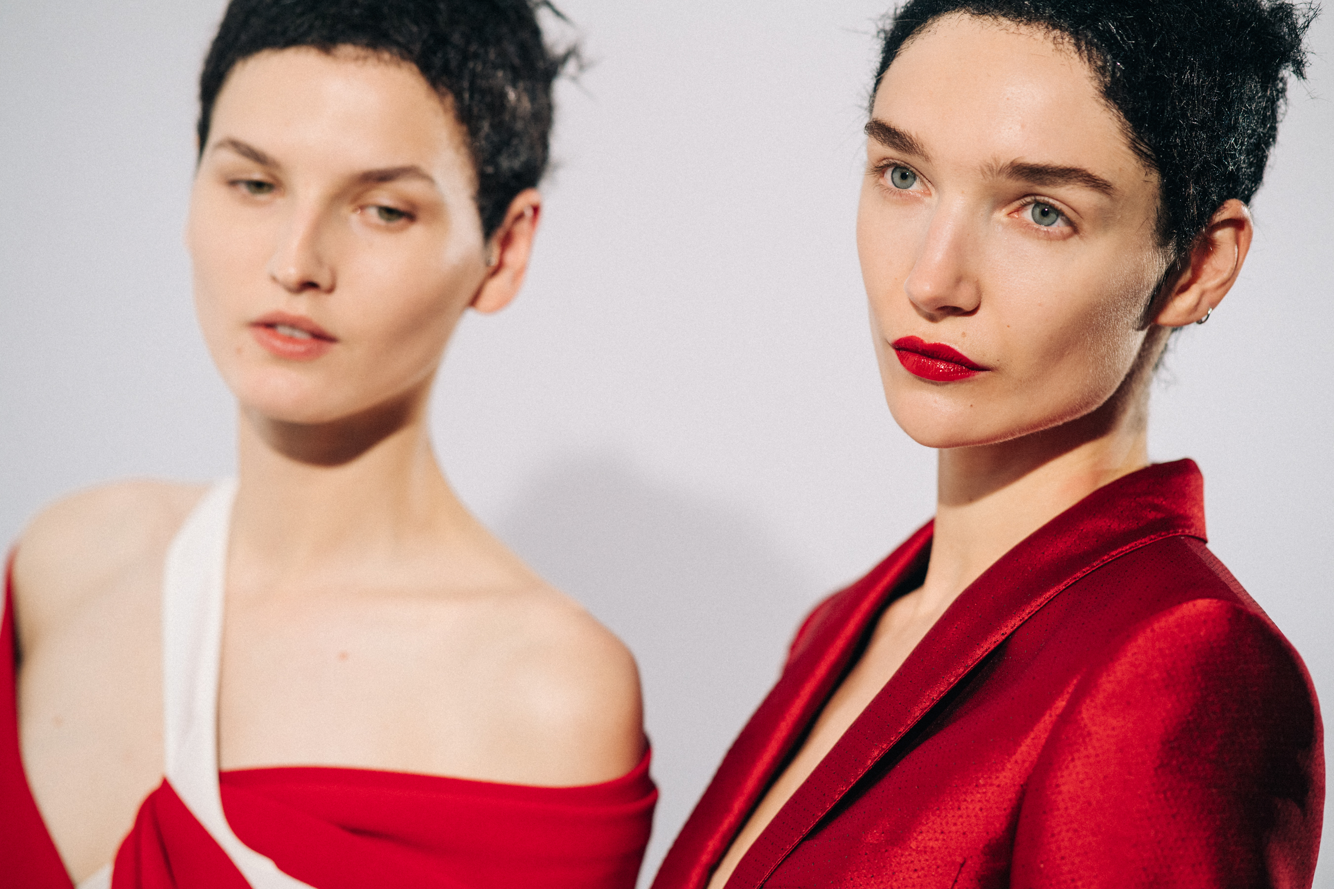 Model wearing red before a show