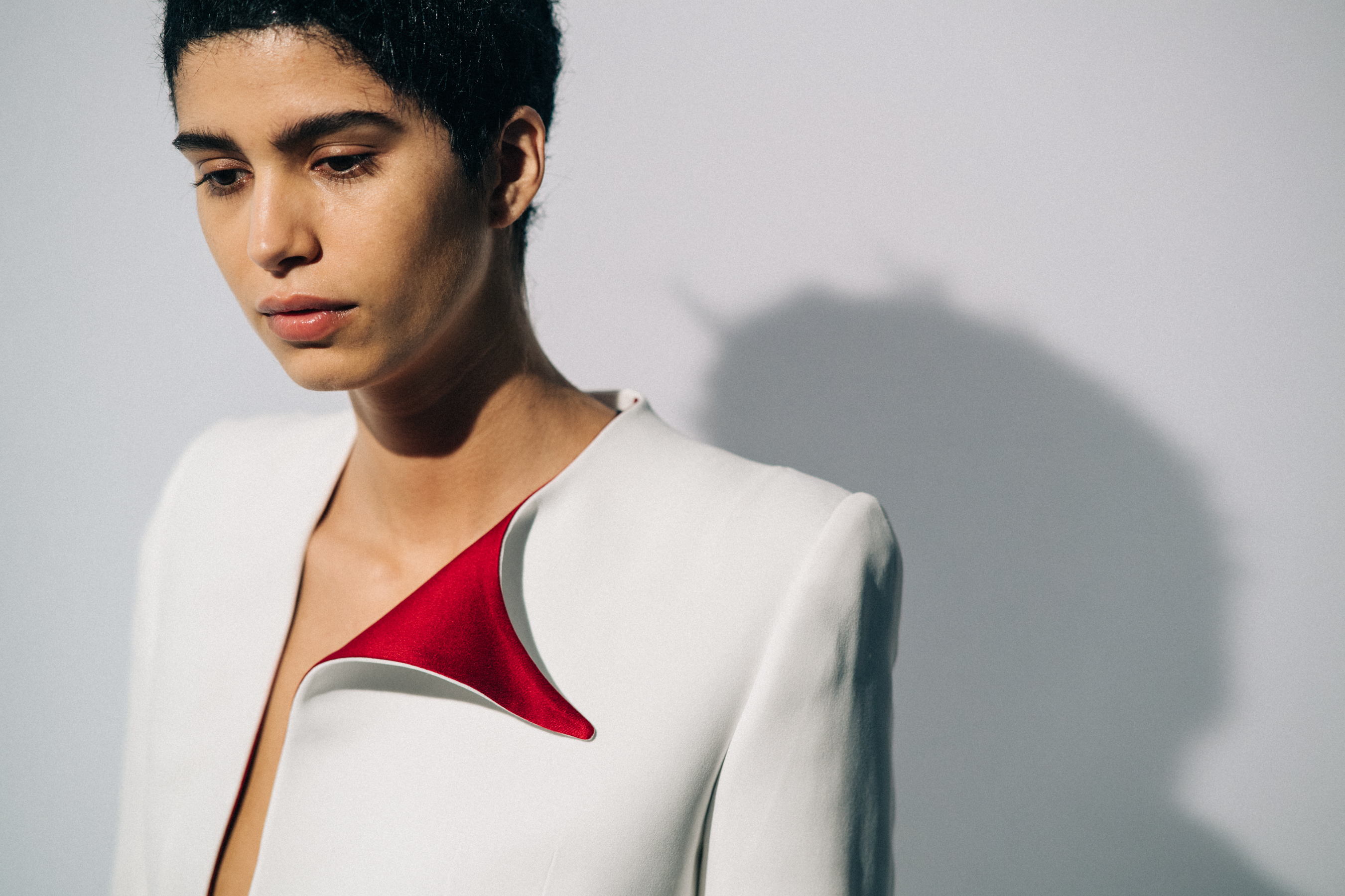 Model wearing white before a show