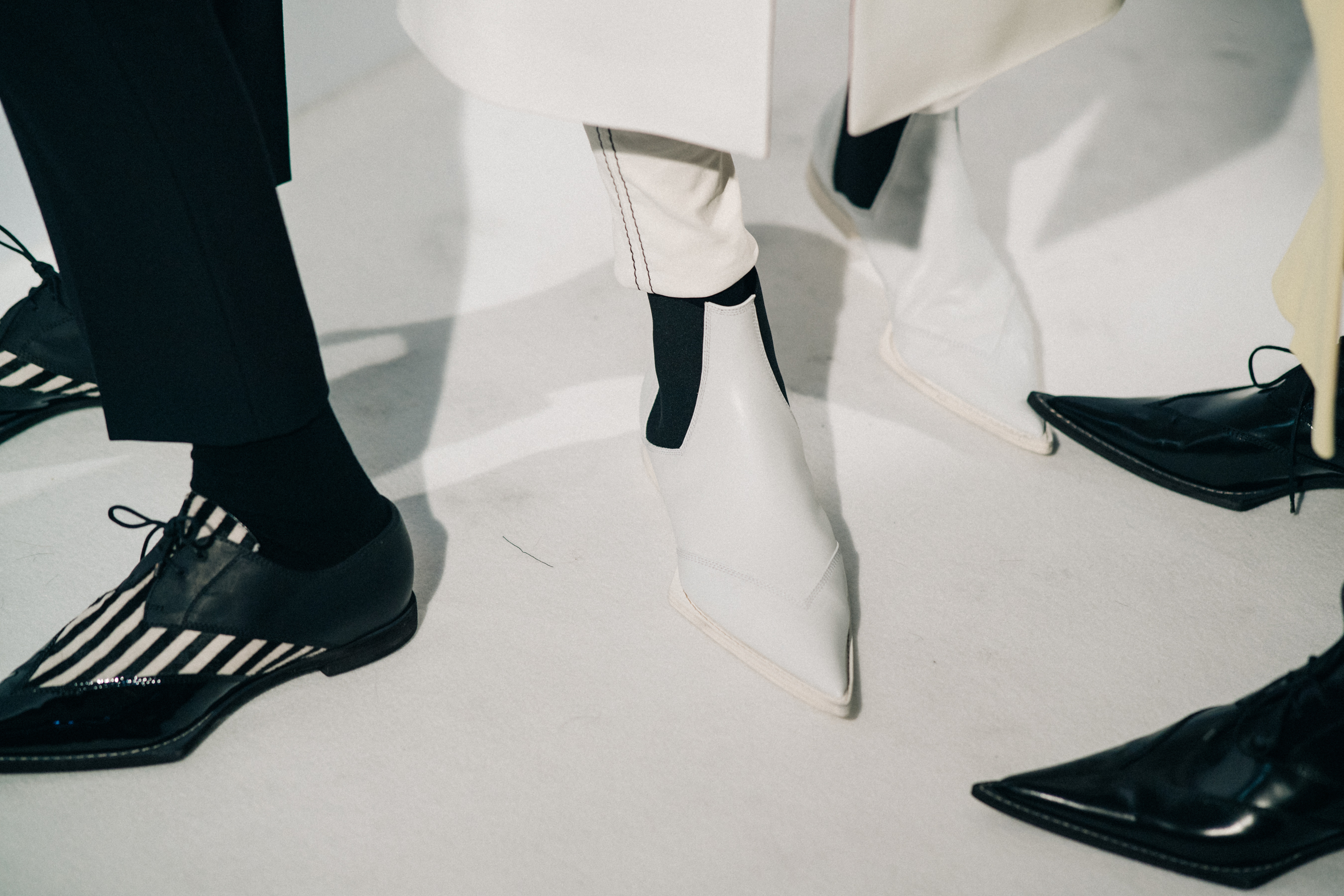Model wearing white before a show