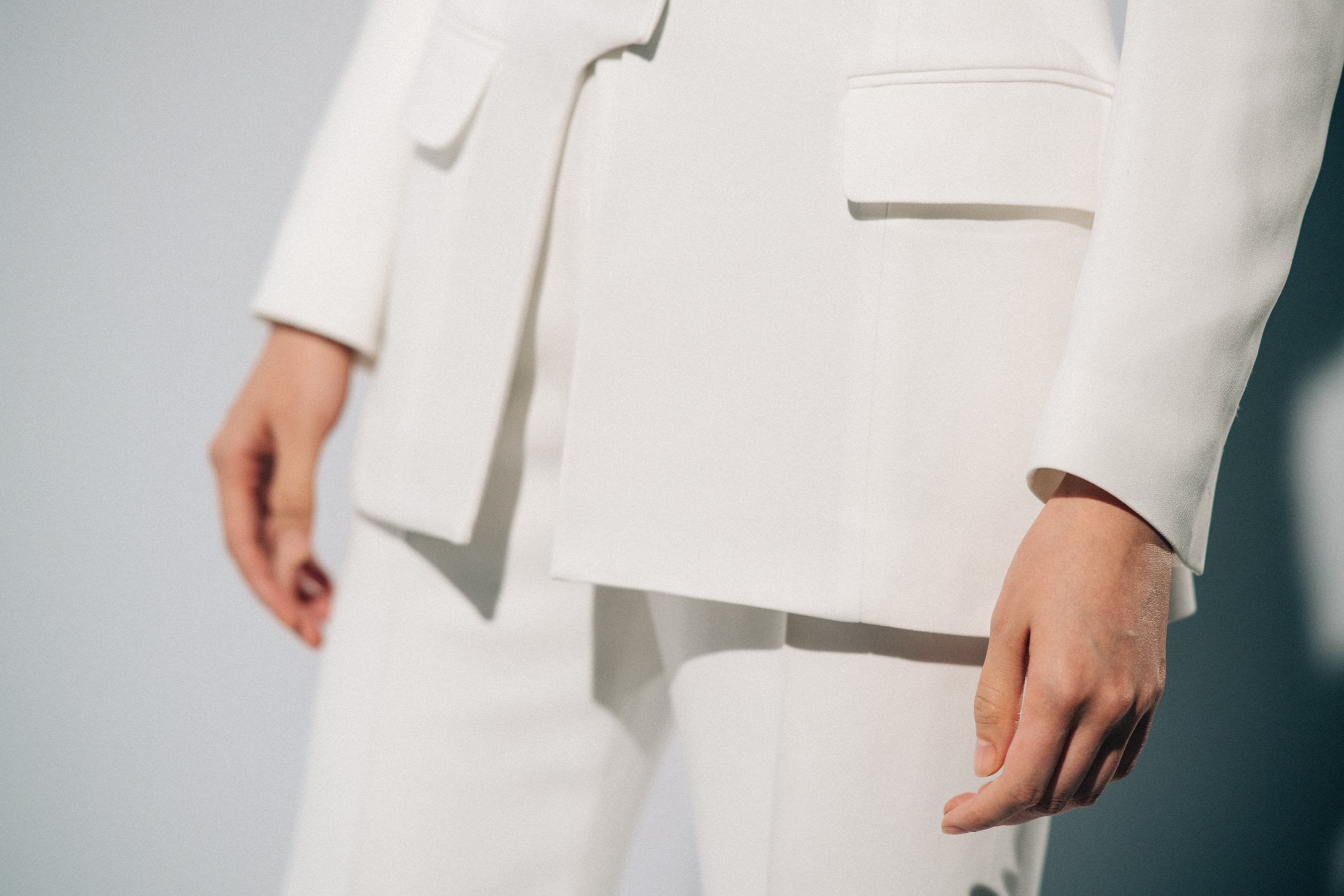 Model wearing white before a show