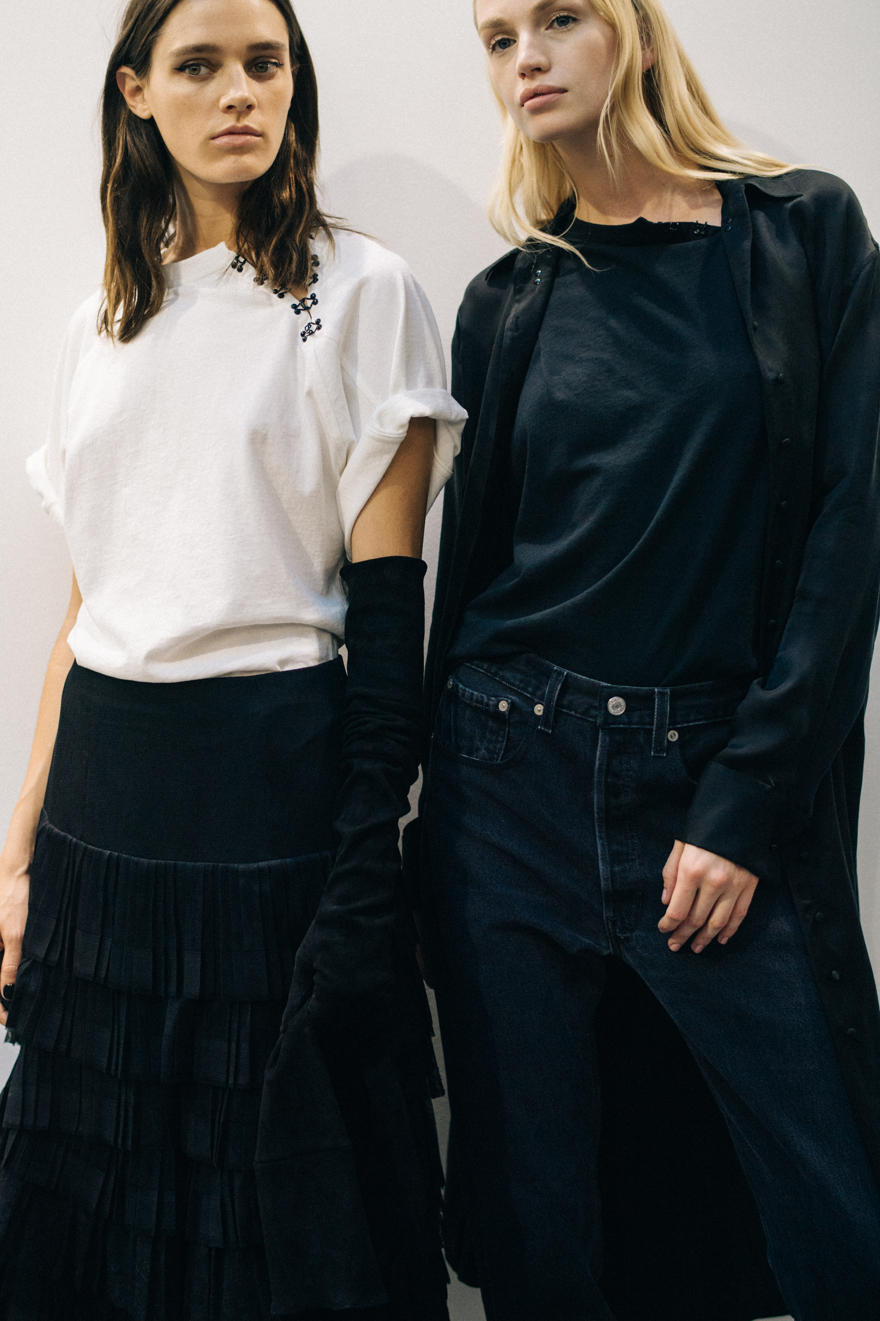 Model wearing black outfit before a show
