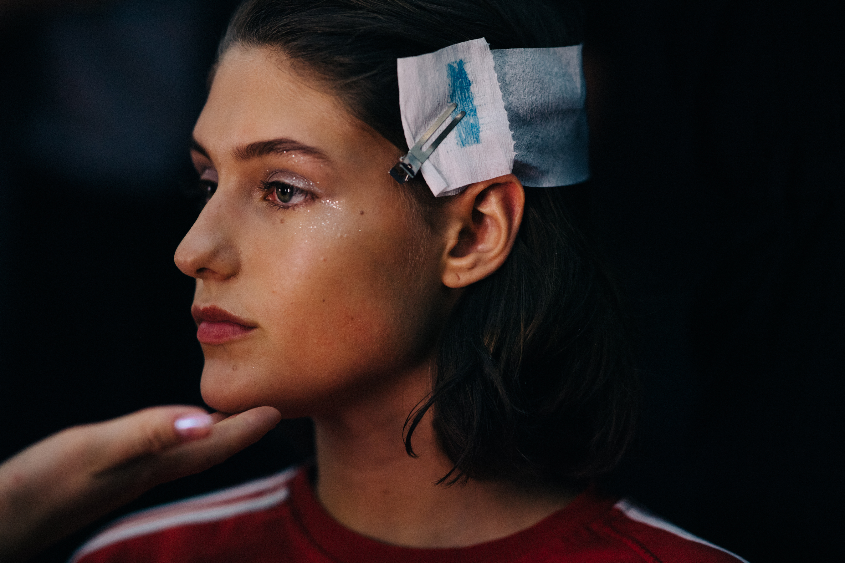 Model is getting make up done