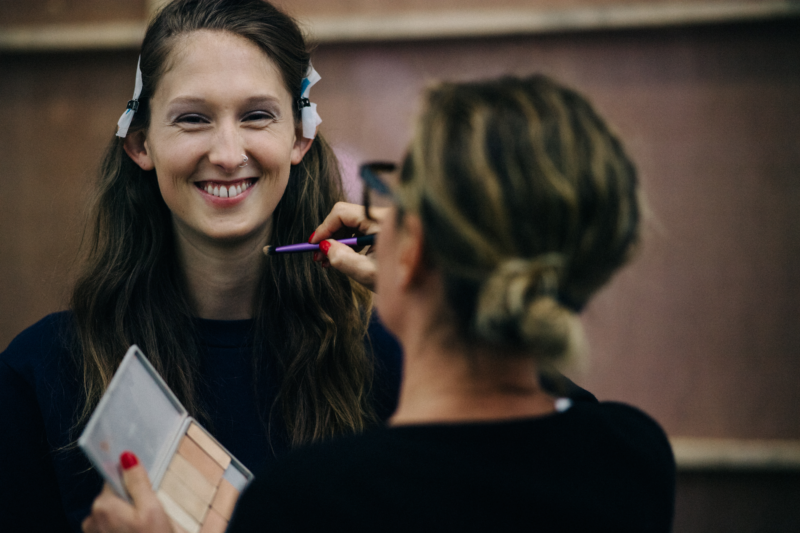 Model is getting make up done