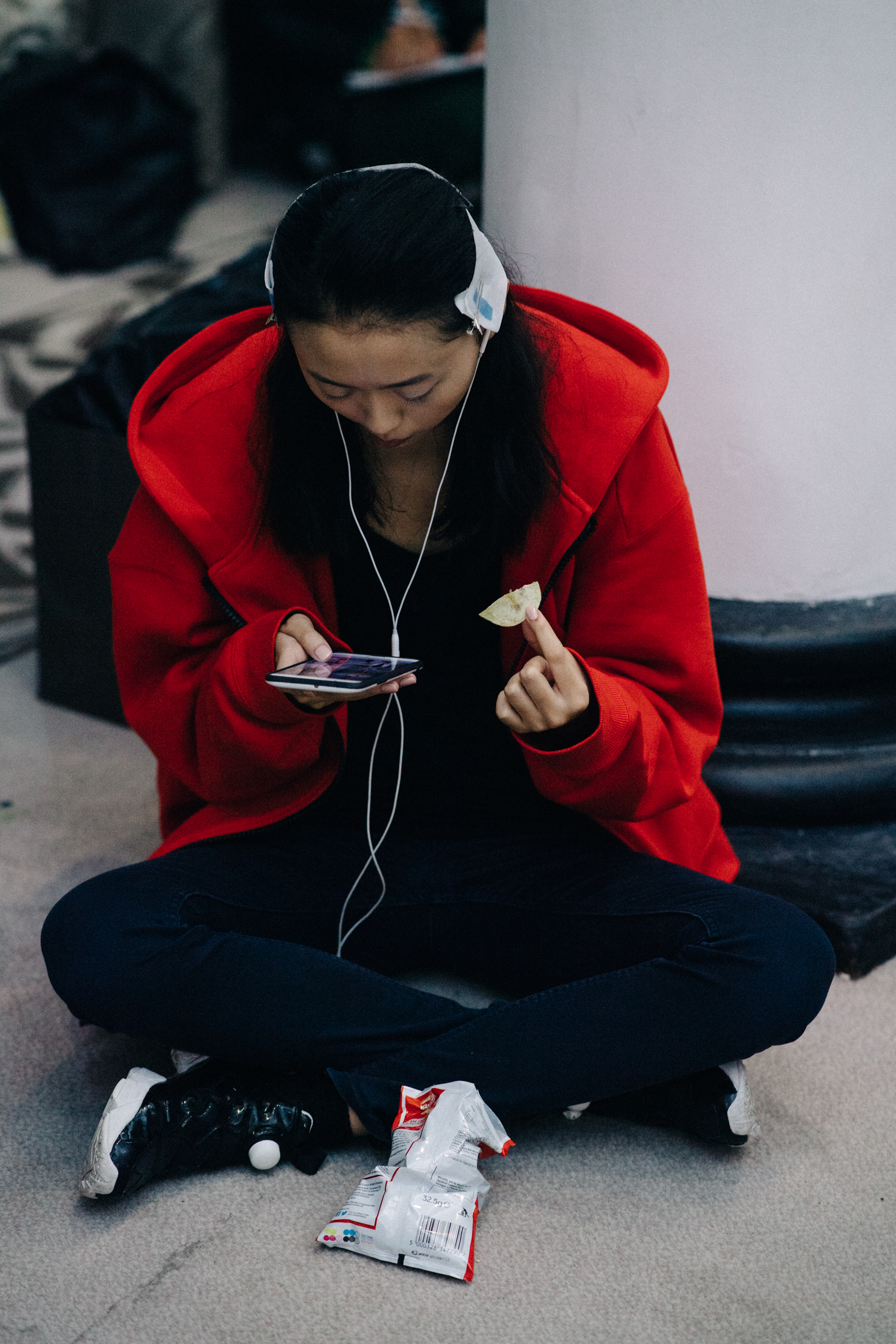 Model wearing red hoodie