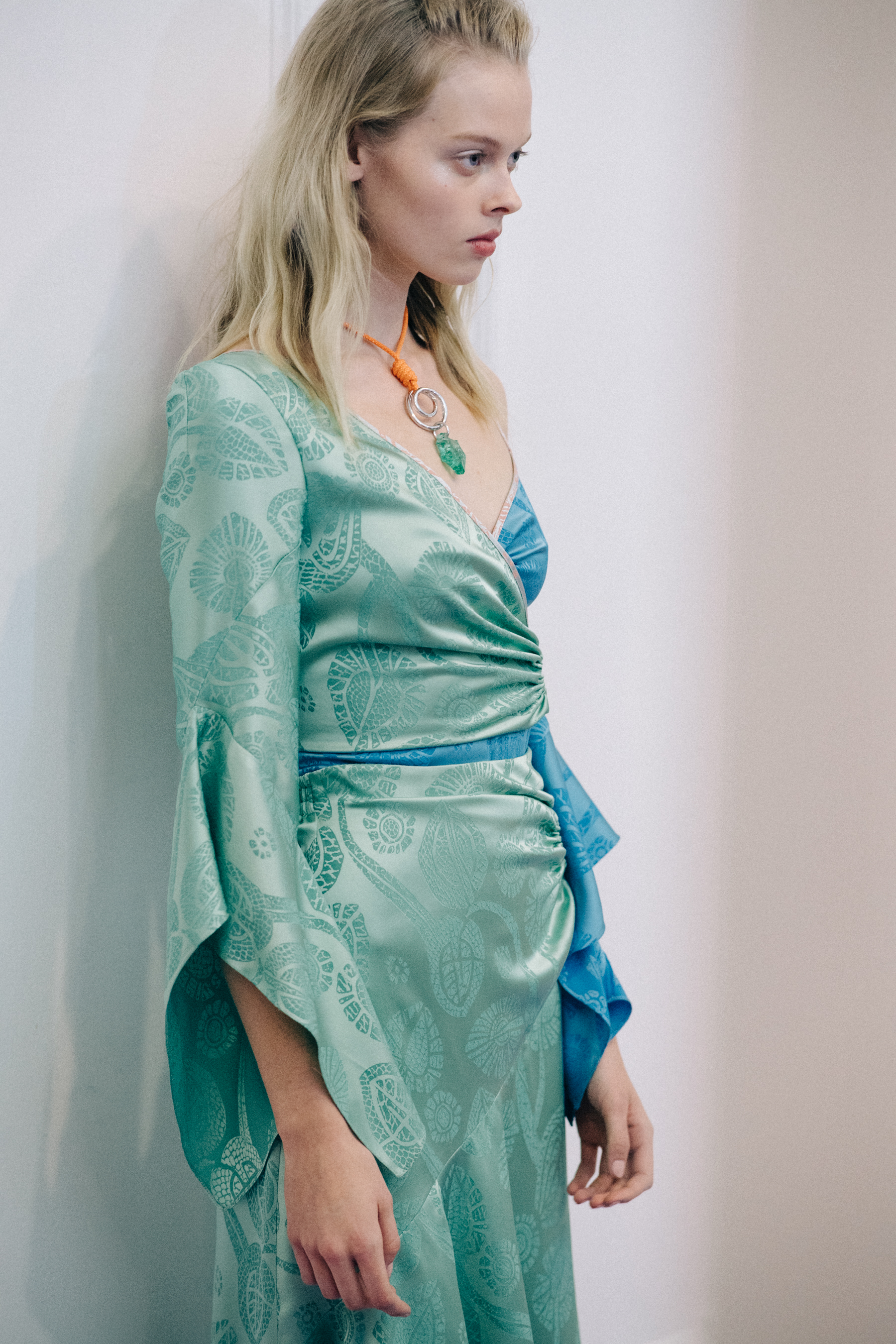 Model wearing green dress