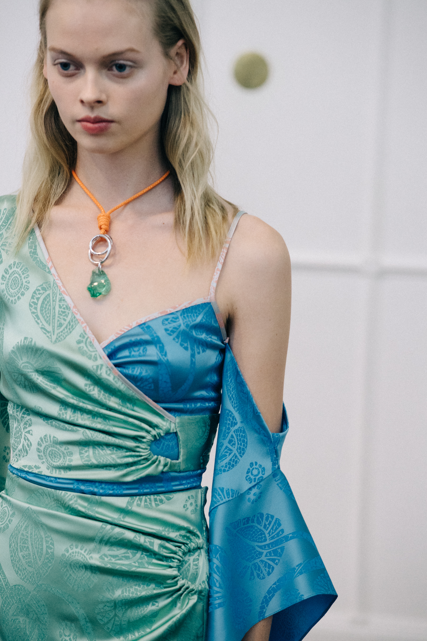 Model wearing green dress