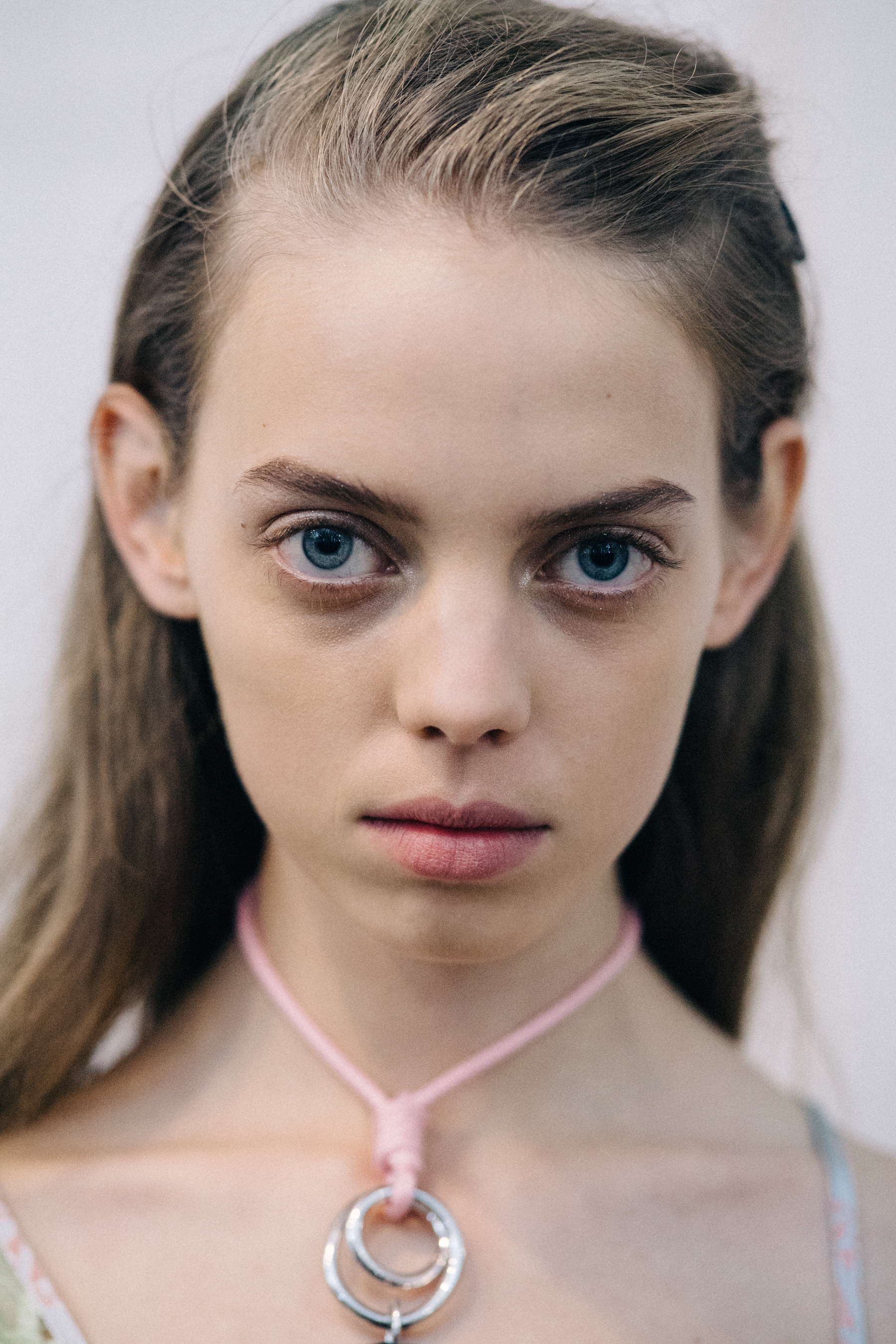 Portrait of a model wearing colourful earrings
