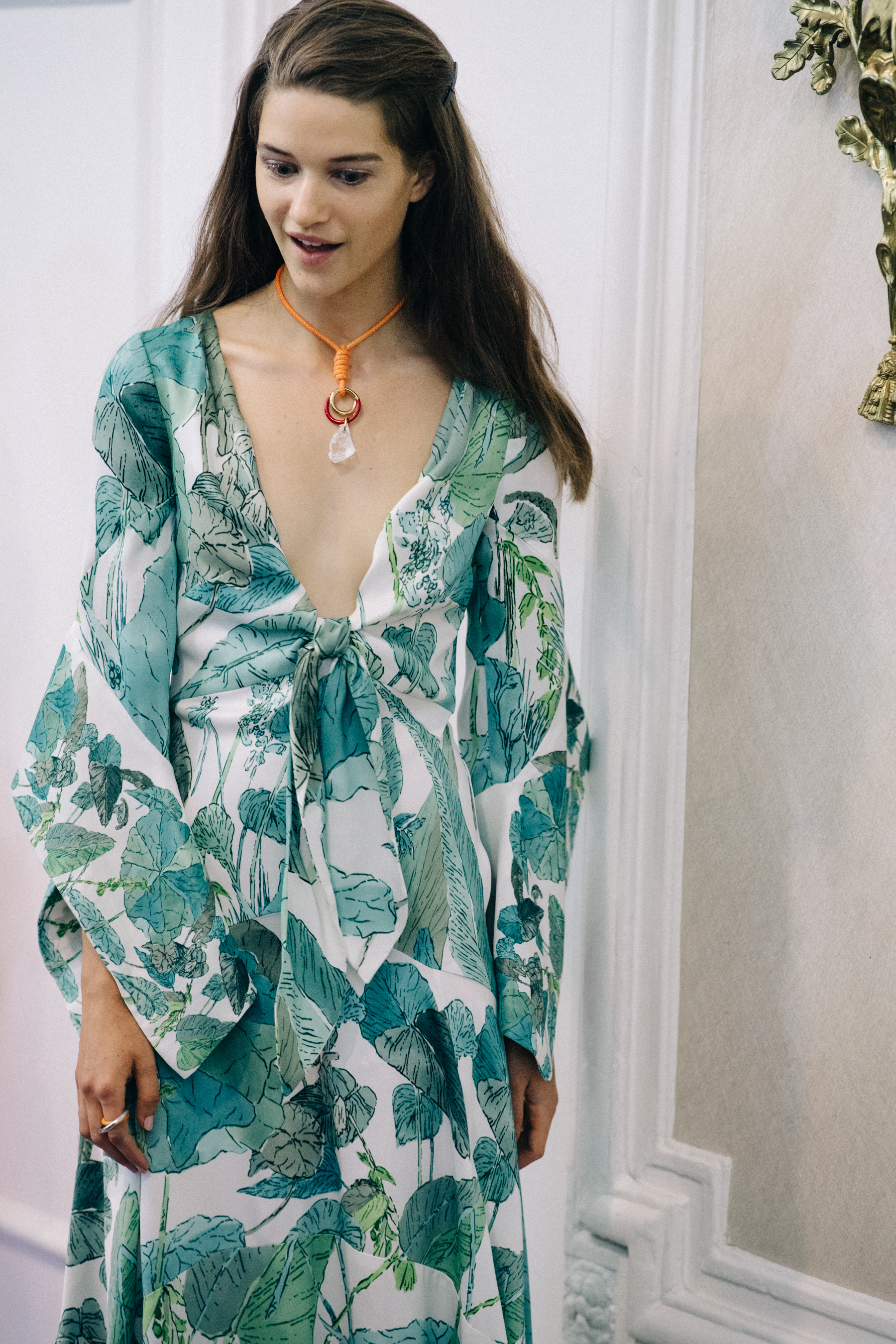 Model wearing green dress