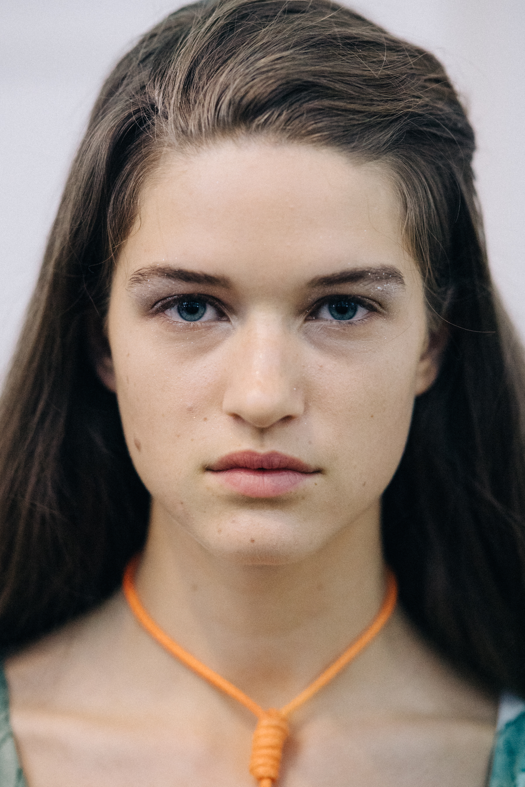 Portrait of a model wearing colourful earrings