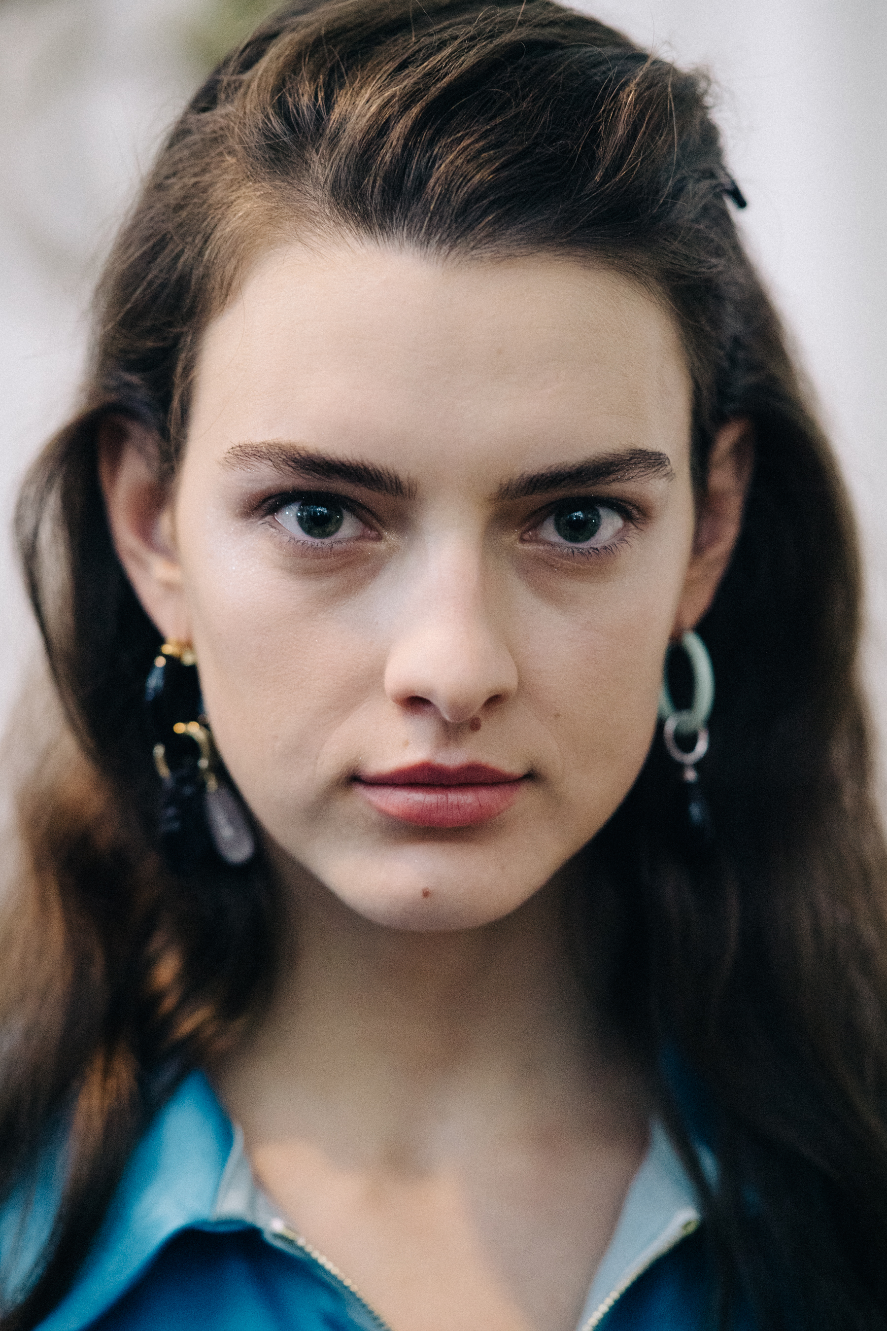 Portrait of a model wearing colourful earrings