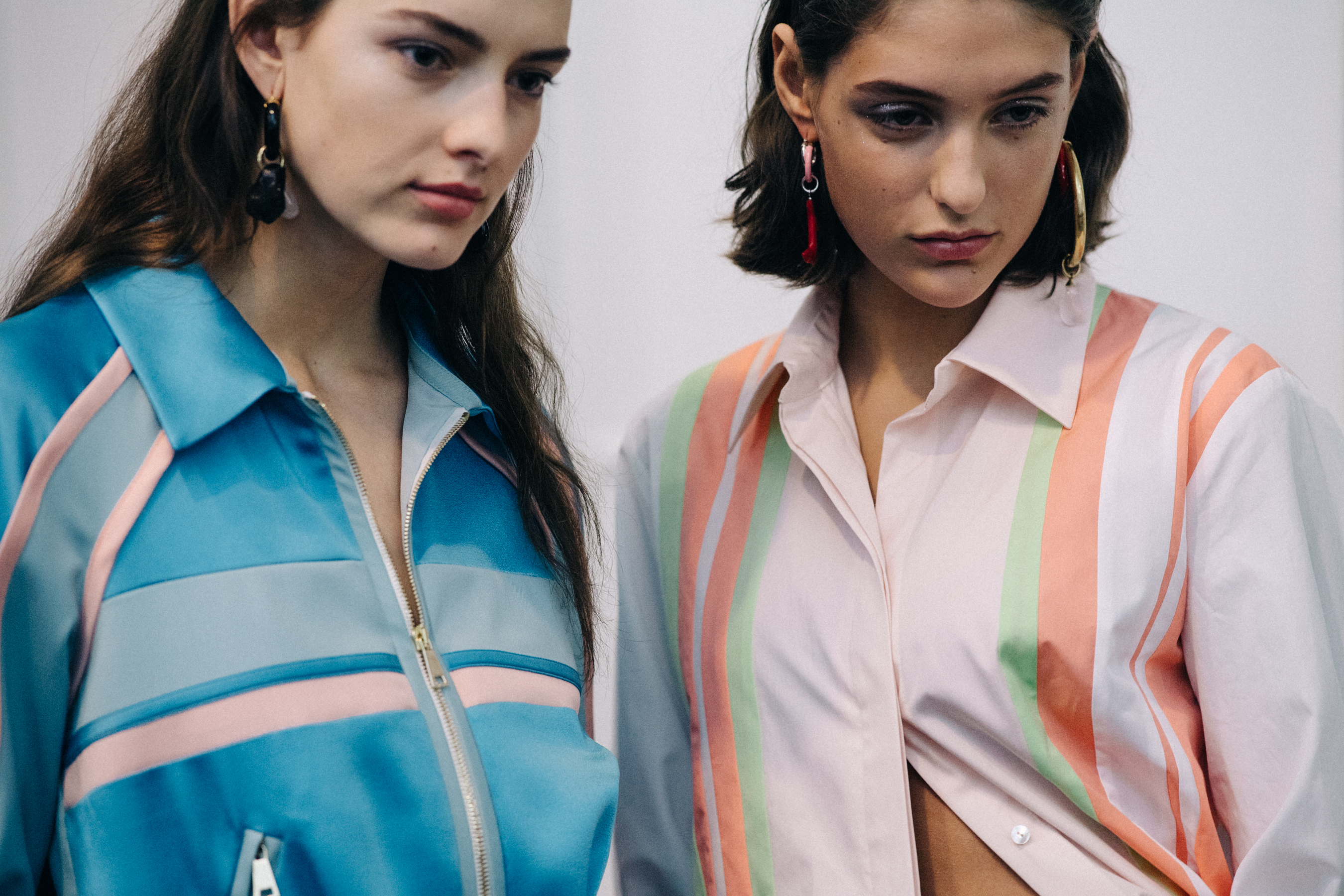 Group of models wearing colourful dresses