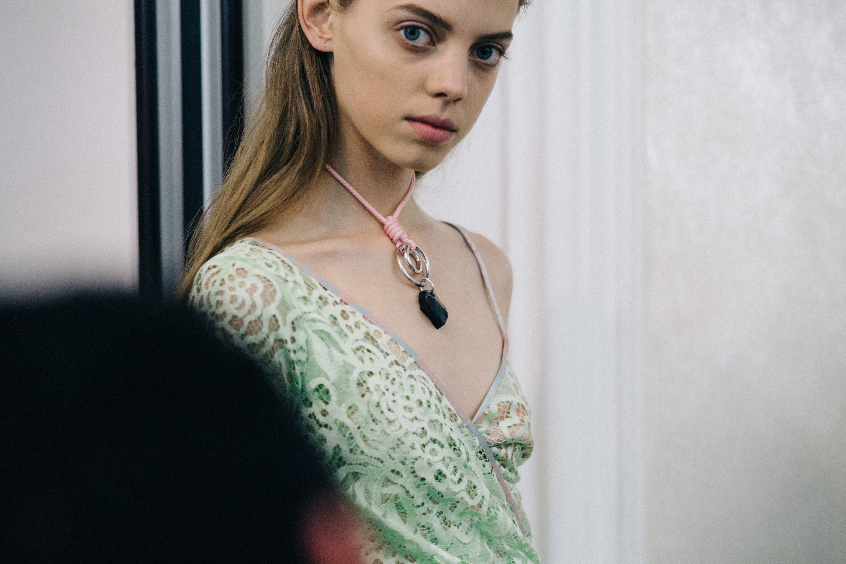 Model wearing green dress