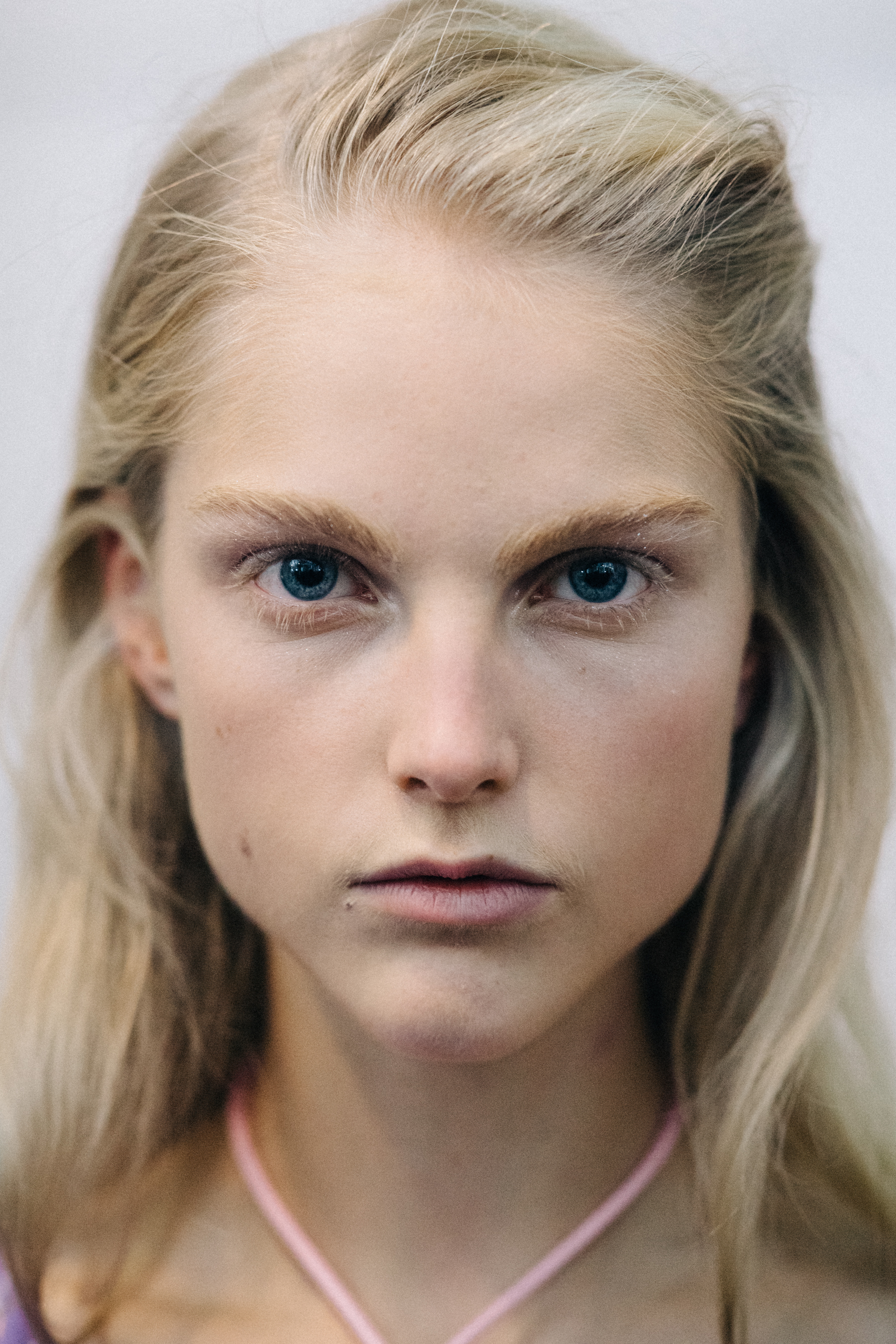 Portrait of a model wearing colourful earrings
