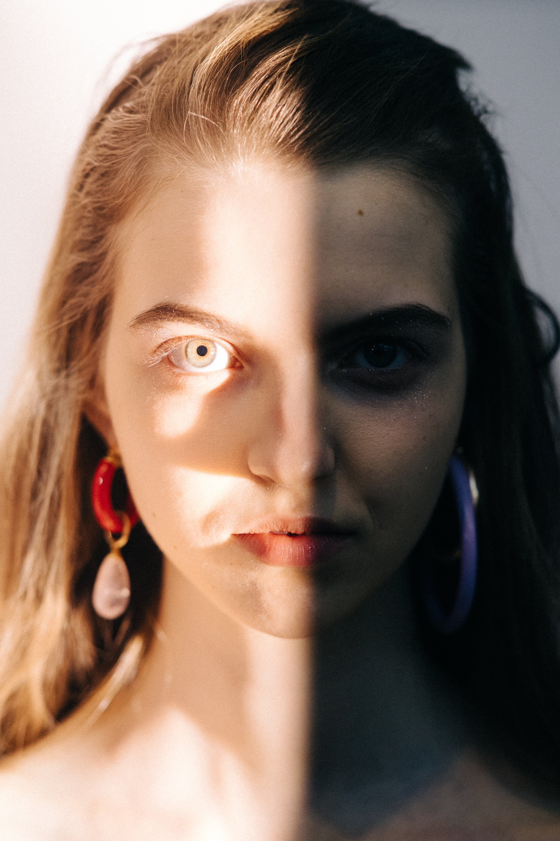 Portrait of a model wearing colourful earrings