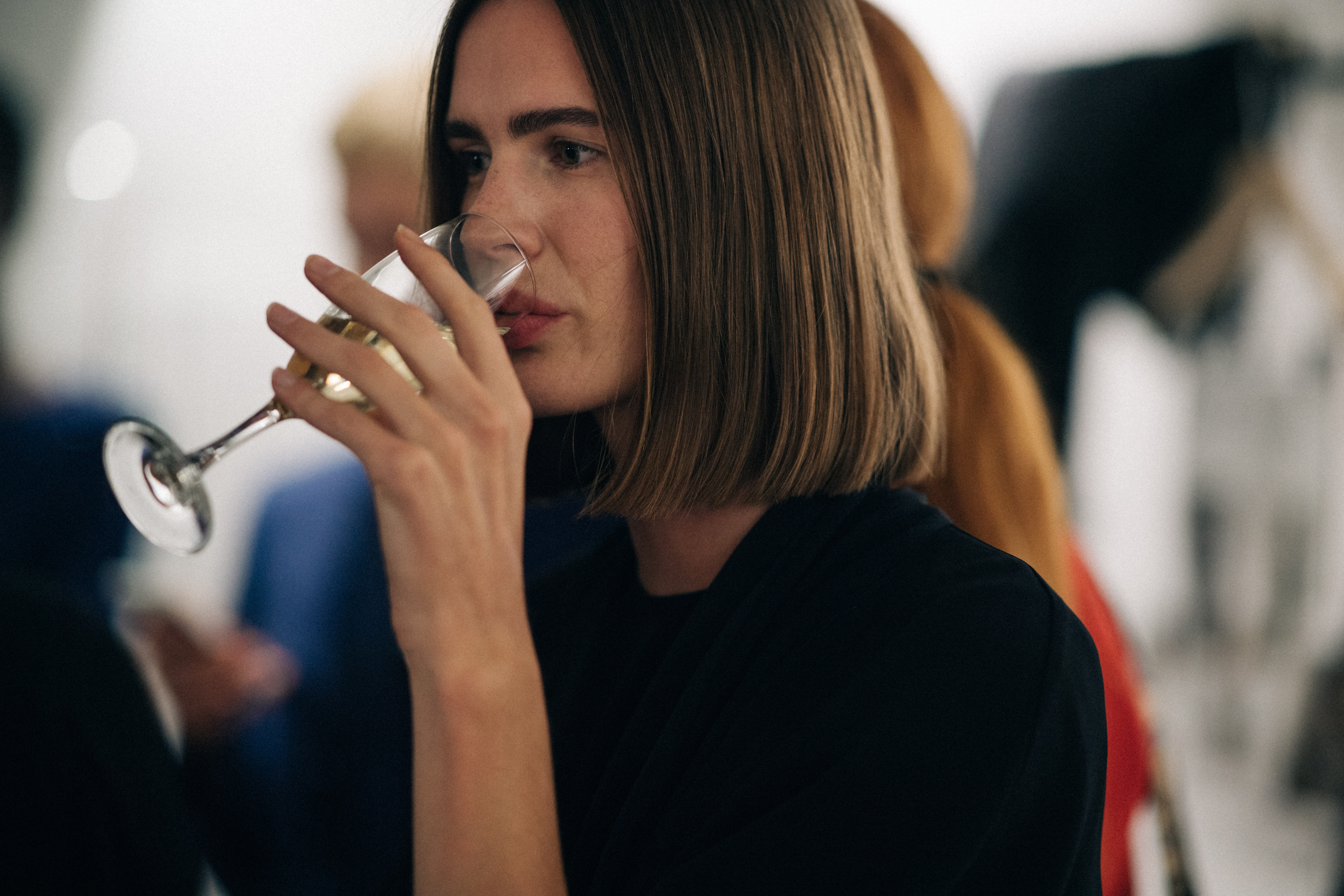 Model drinking champagne before the show