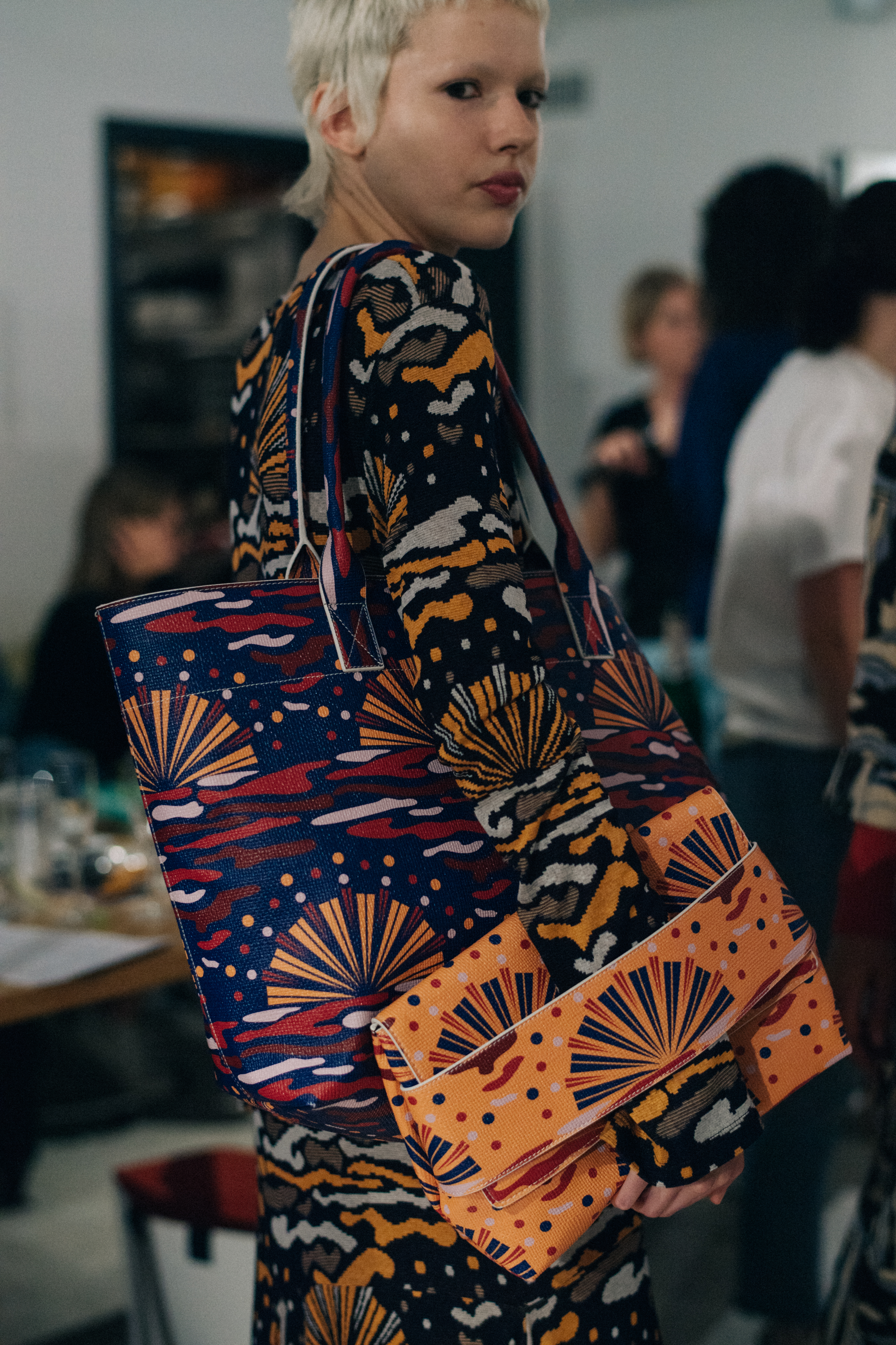 Model wearing colourful printed outfits